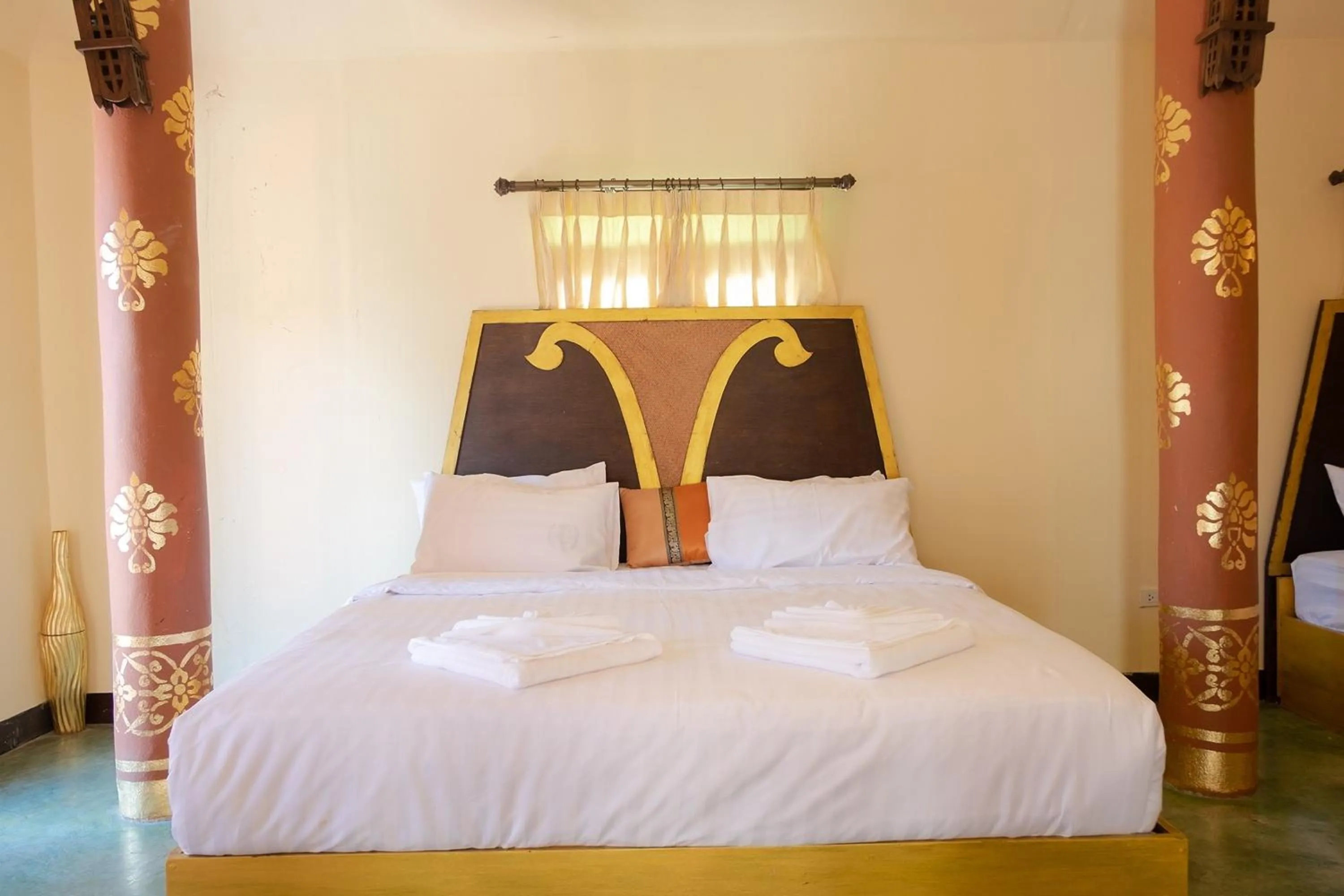 Bed in Baan Tawai Lanna Resort