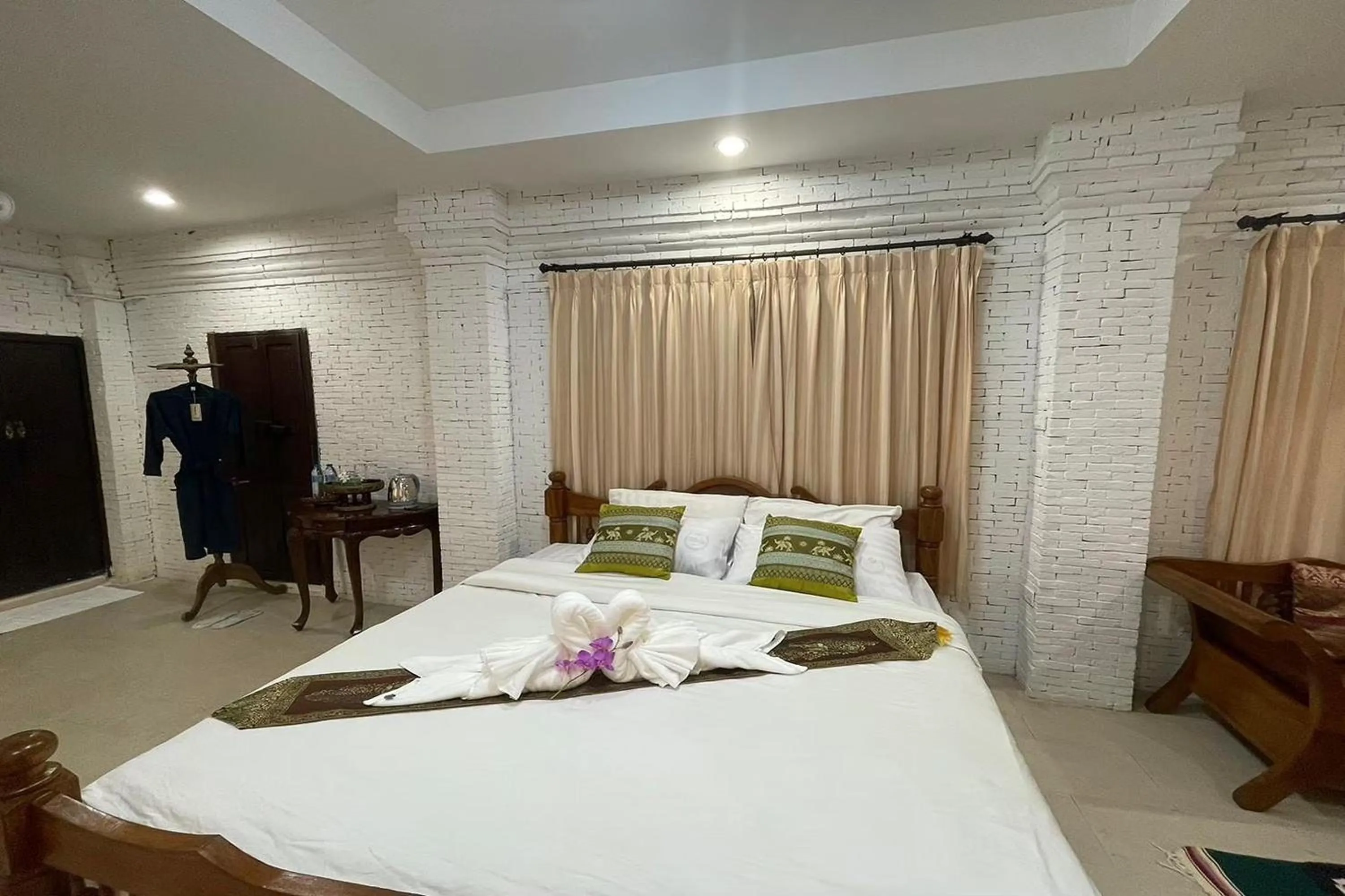 Bed in Baan Tawai Lanna Resort