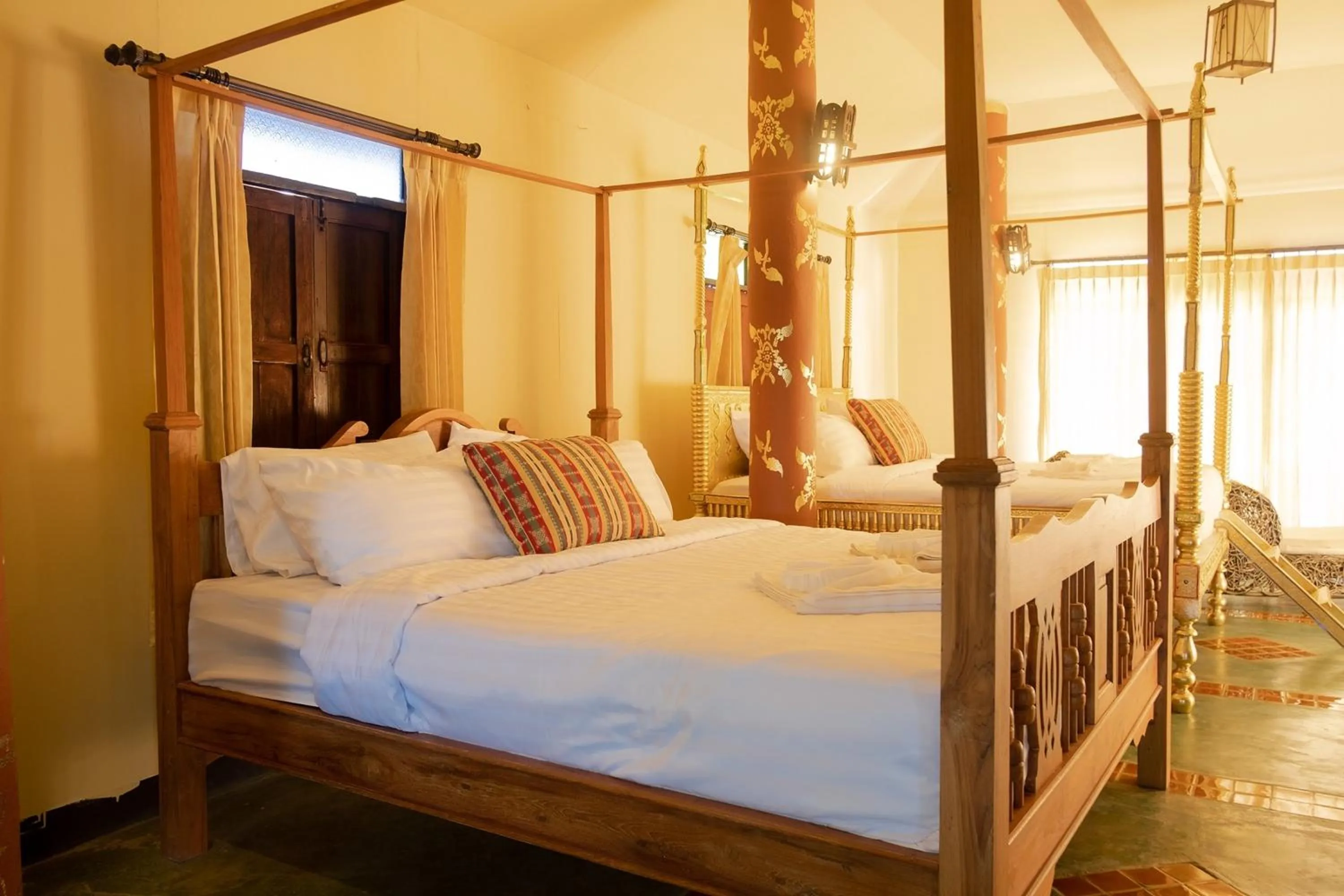 Bed in Baan Tawai Lanna Resort
