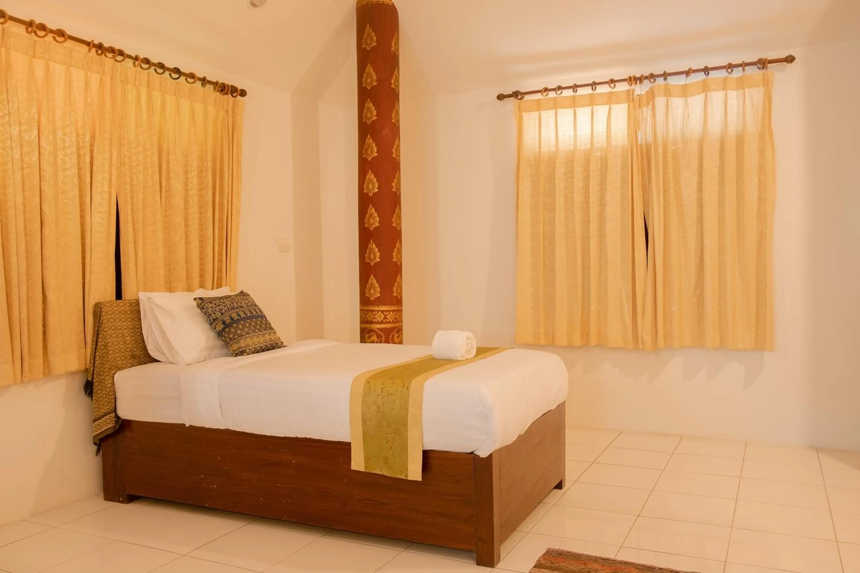 Bed in Baan Tawai Lanna Resort