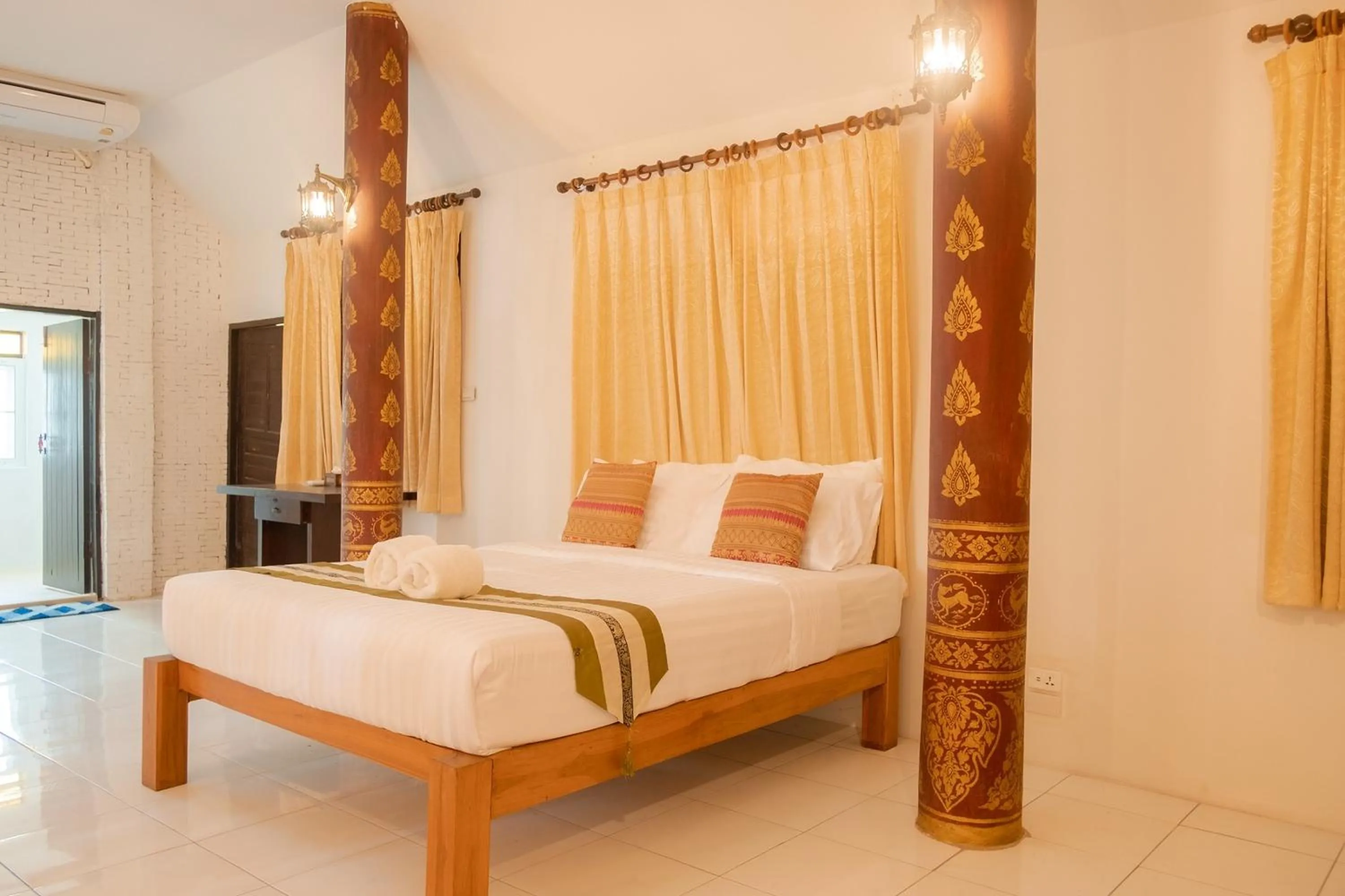 Bed in Baan Tawai Lanna Resort