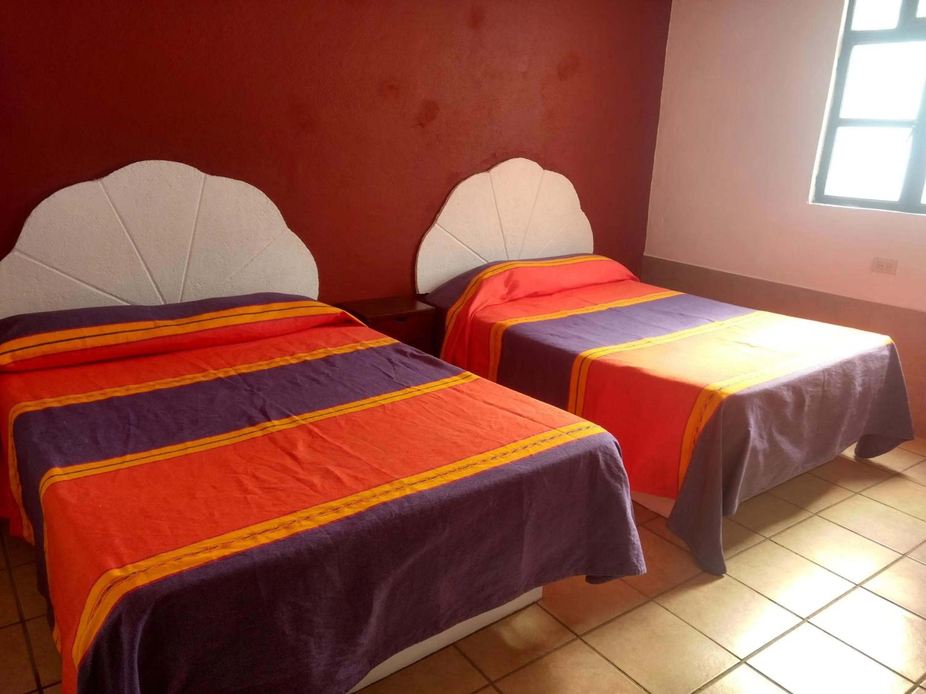 Bed in Hotel Hacienda Morales.