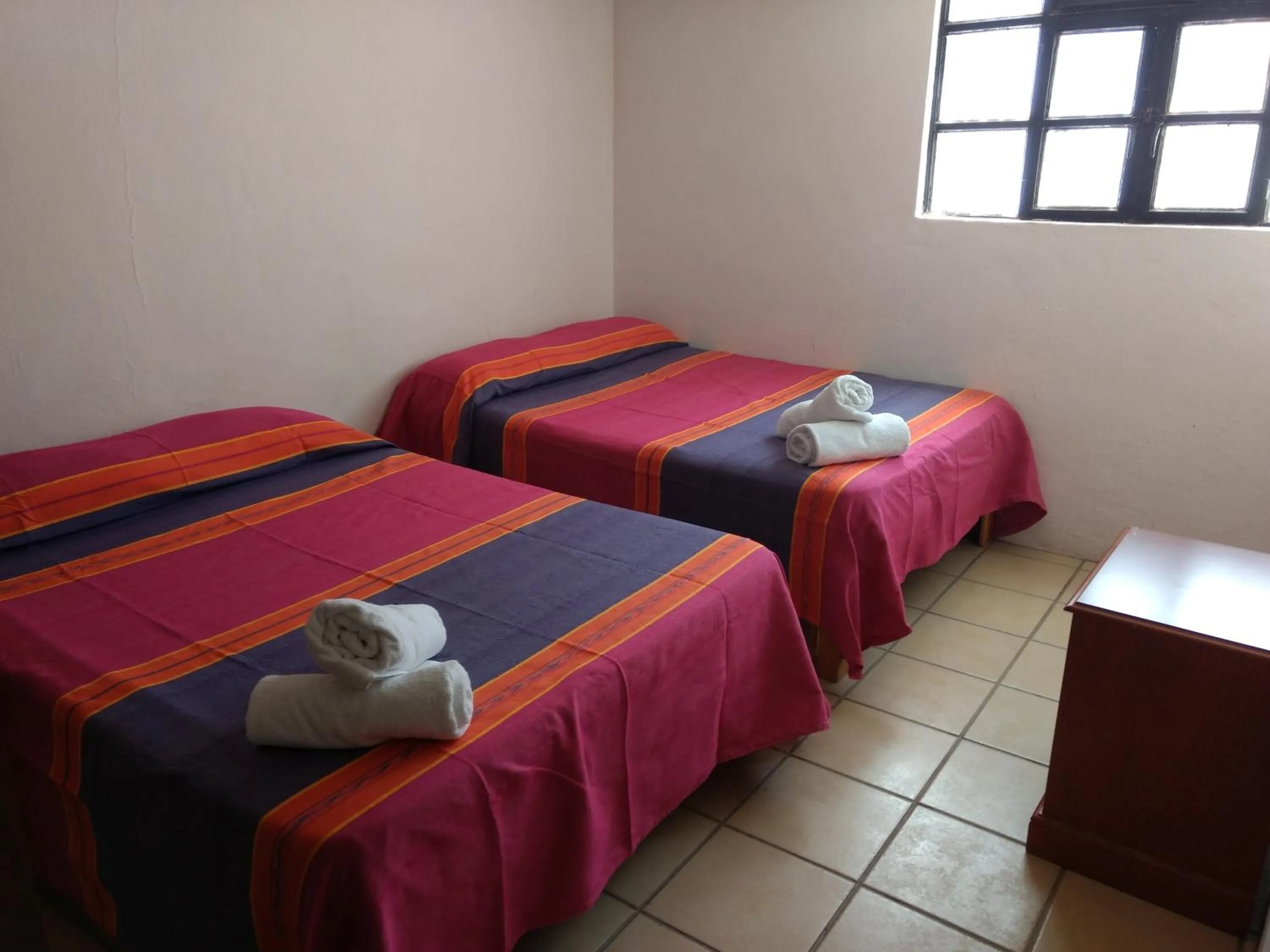 Bed in Hotel Hacienda Morales.