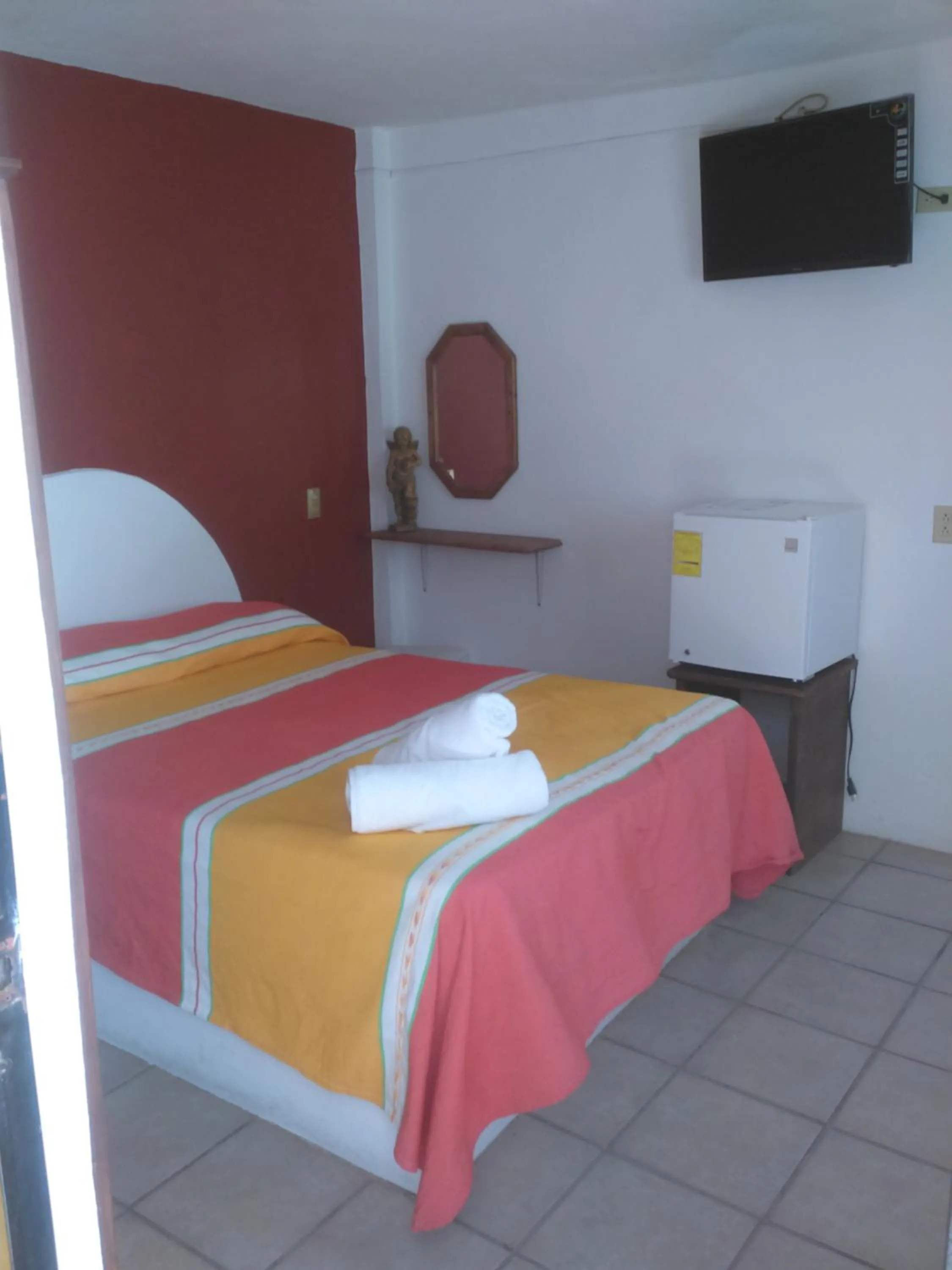 Bed in Hotel Hacienda Morales.