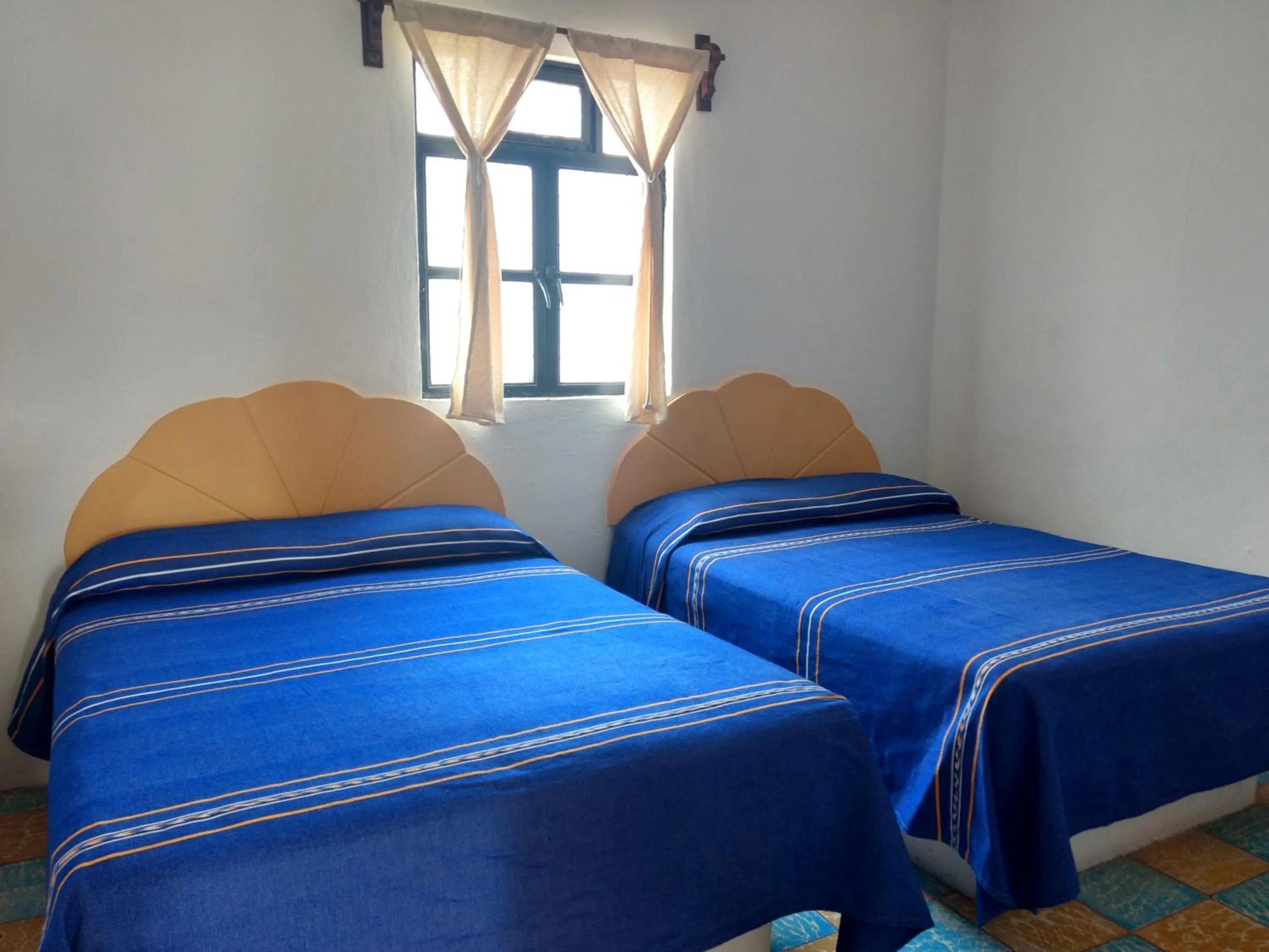 Bed in Hotel Hacienda Morales.