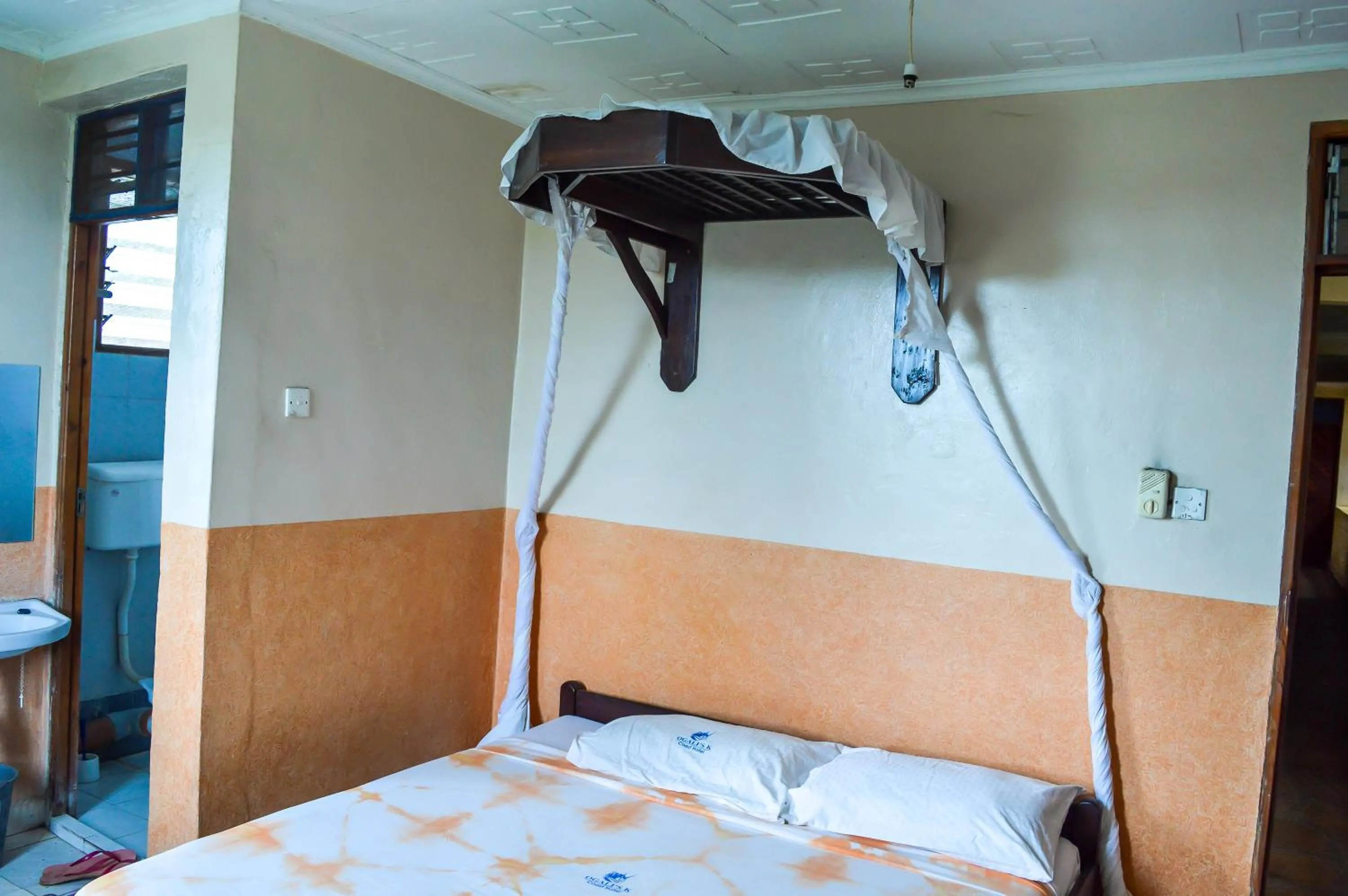 Bed in Ogalis K-coast Hotel