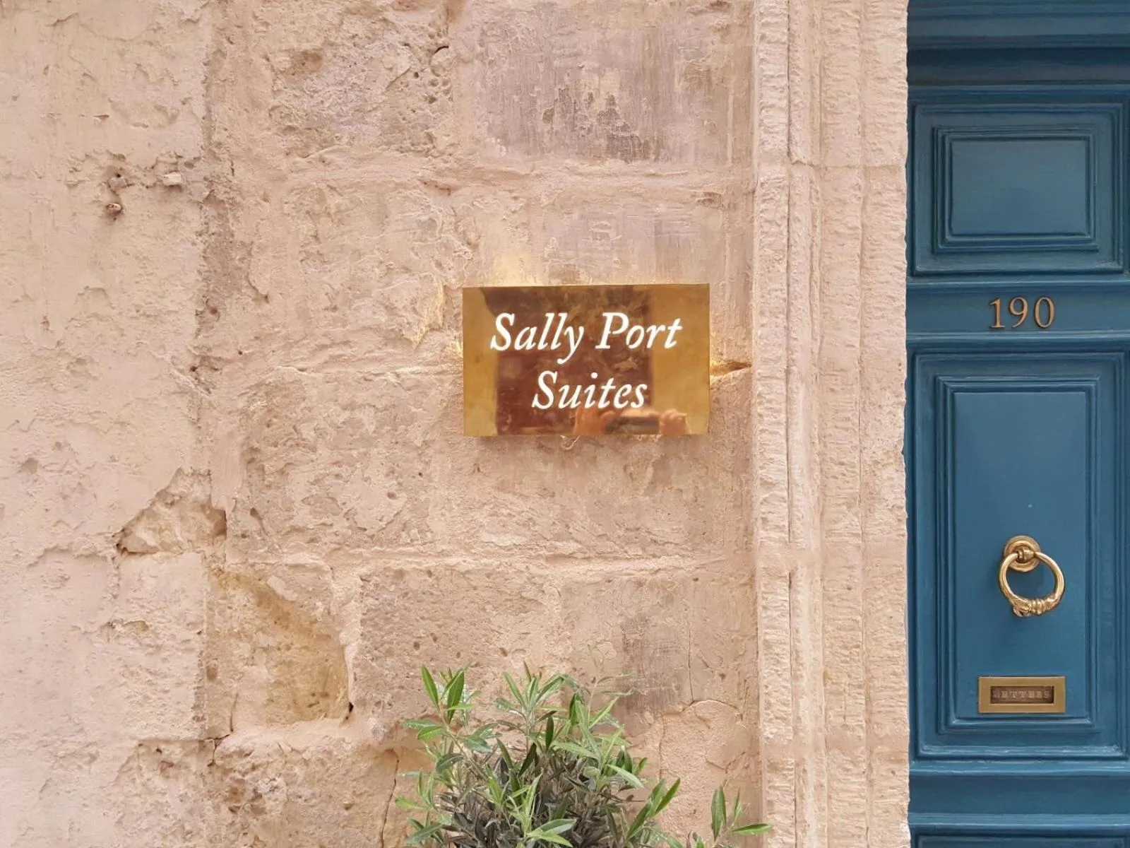 Property logo or sign in Sally Port Suites