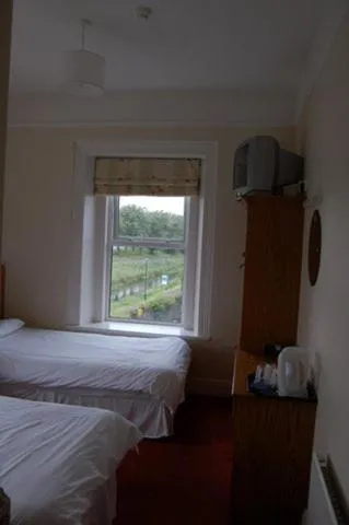 Bed in Railway House Guest House