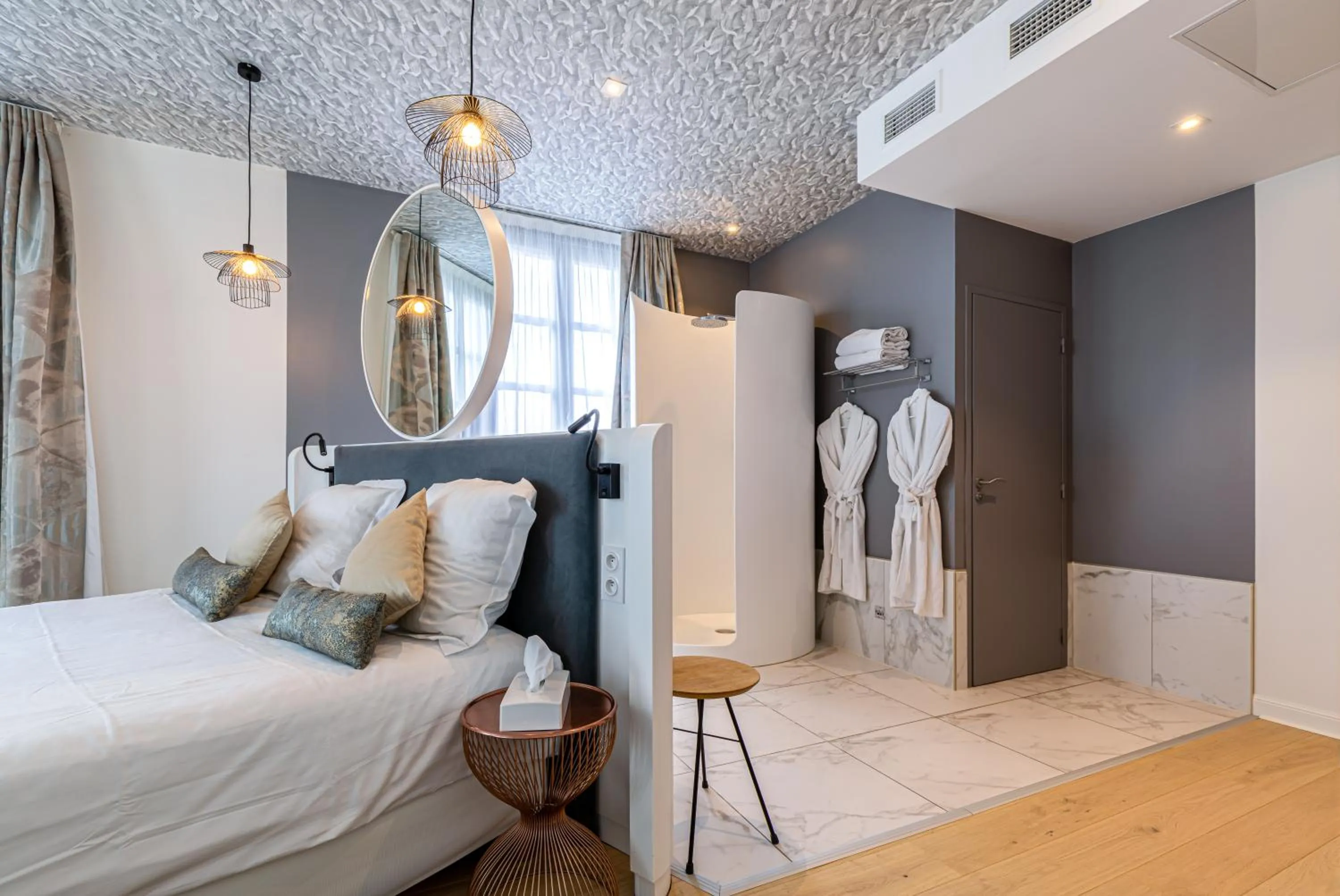 Bed in Hotel Le Saint Gelais