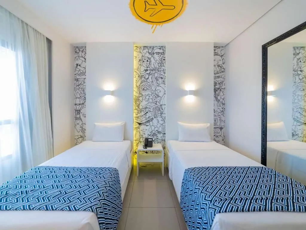 Bed in Golden Tower Maracanaú by Fênix Hotéis