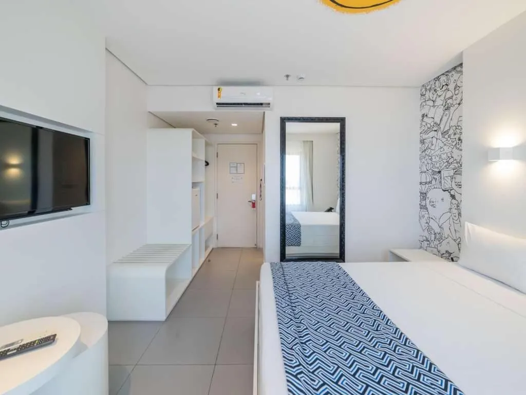 Bed in Golden Tower Maracanaú by Fênix Hotéis