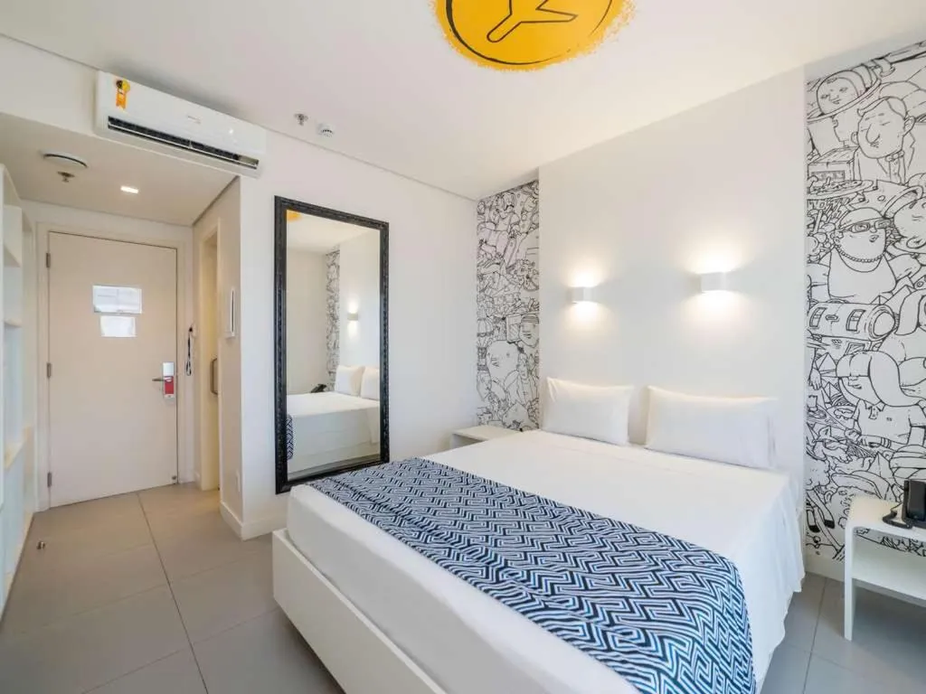 Bed in Golden Tower Maracanaú by Fênix Hotéis