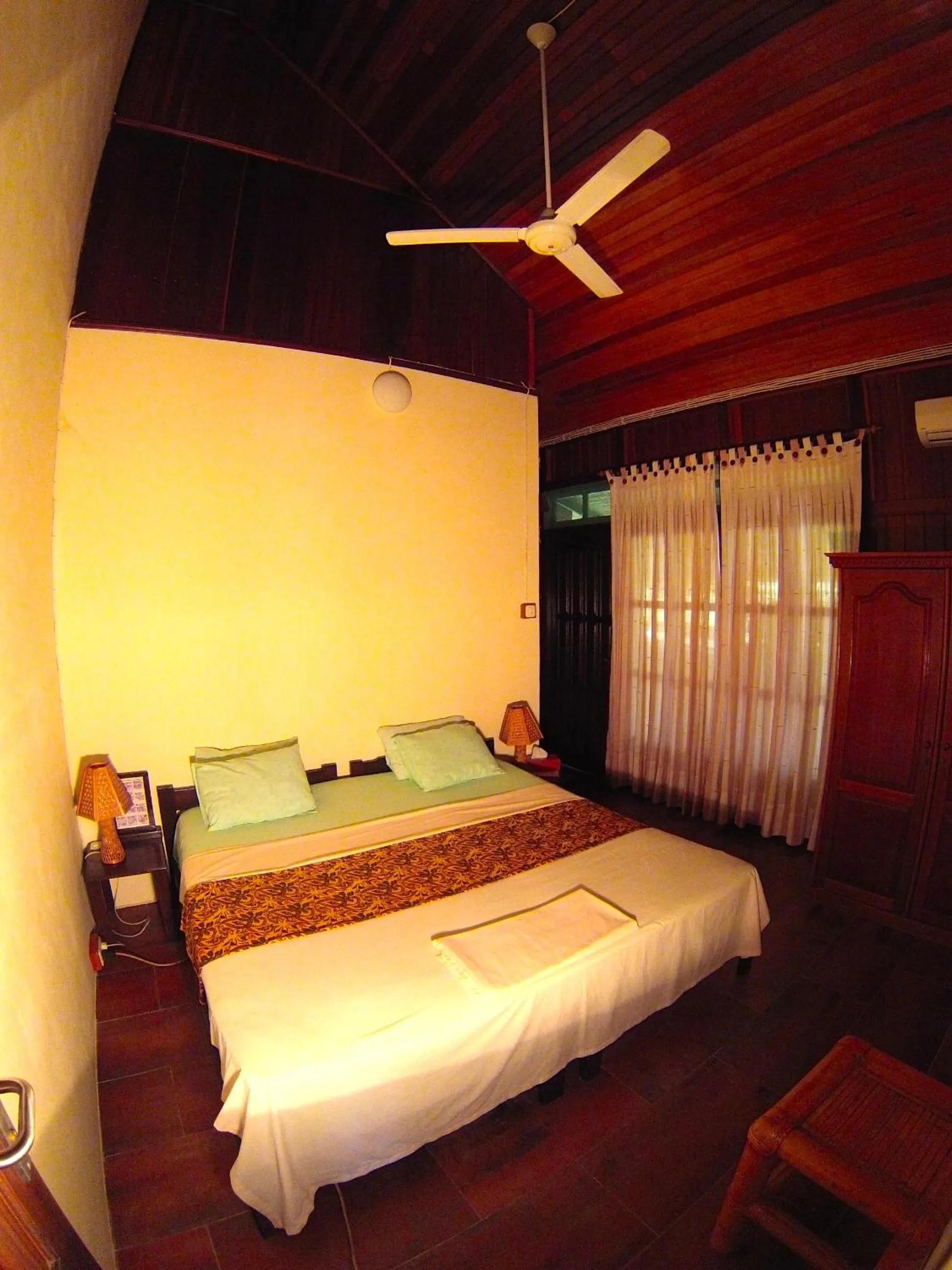 Bed in Lumbalumba Resort - Manado