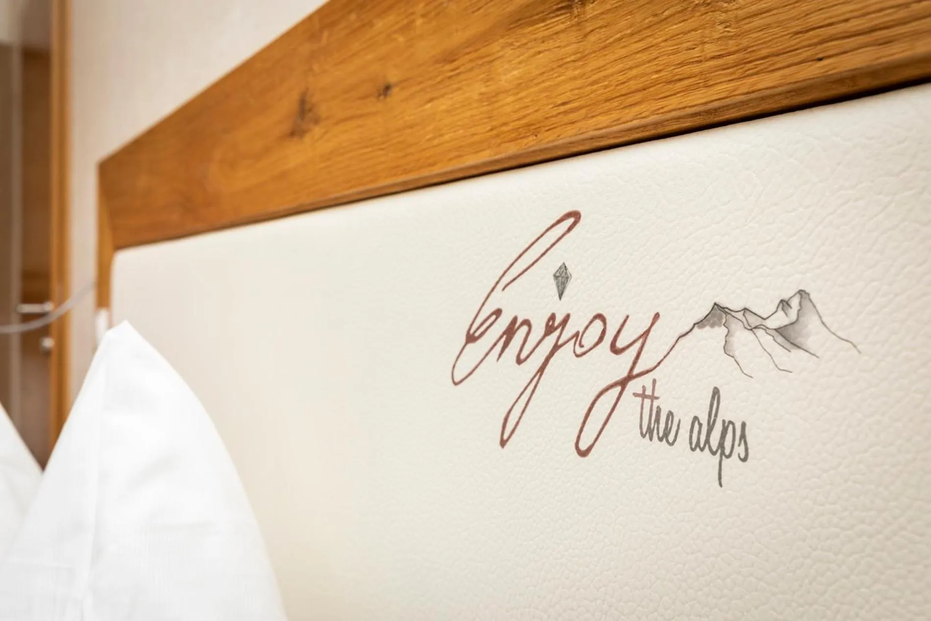 Property logo or sign in Enjoy The Alps