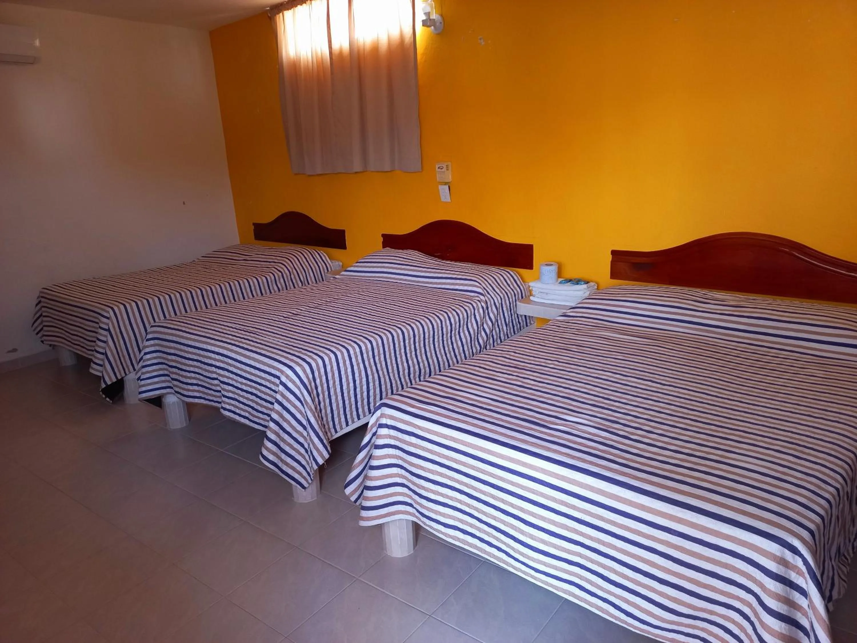 Bed in Posada Casa Bugambilias