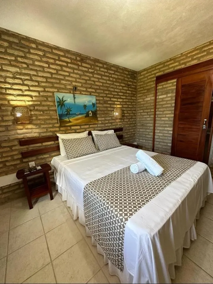 Bed in Pousada Catavento