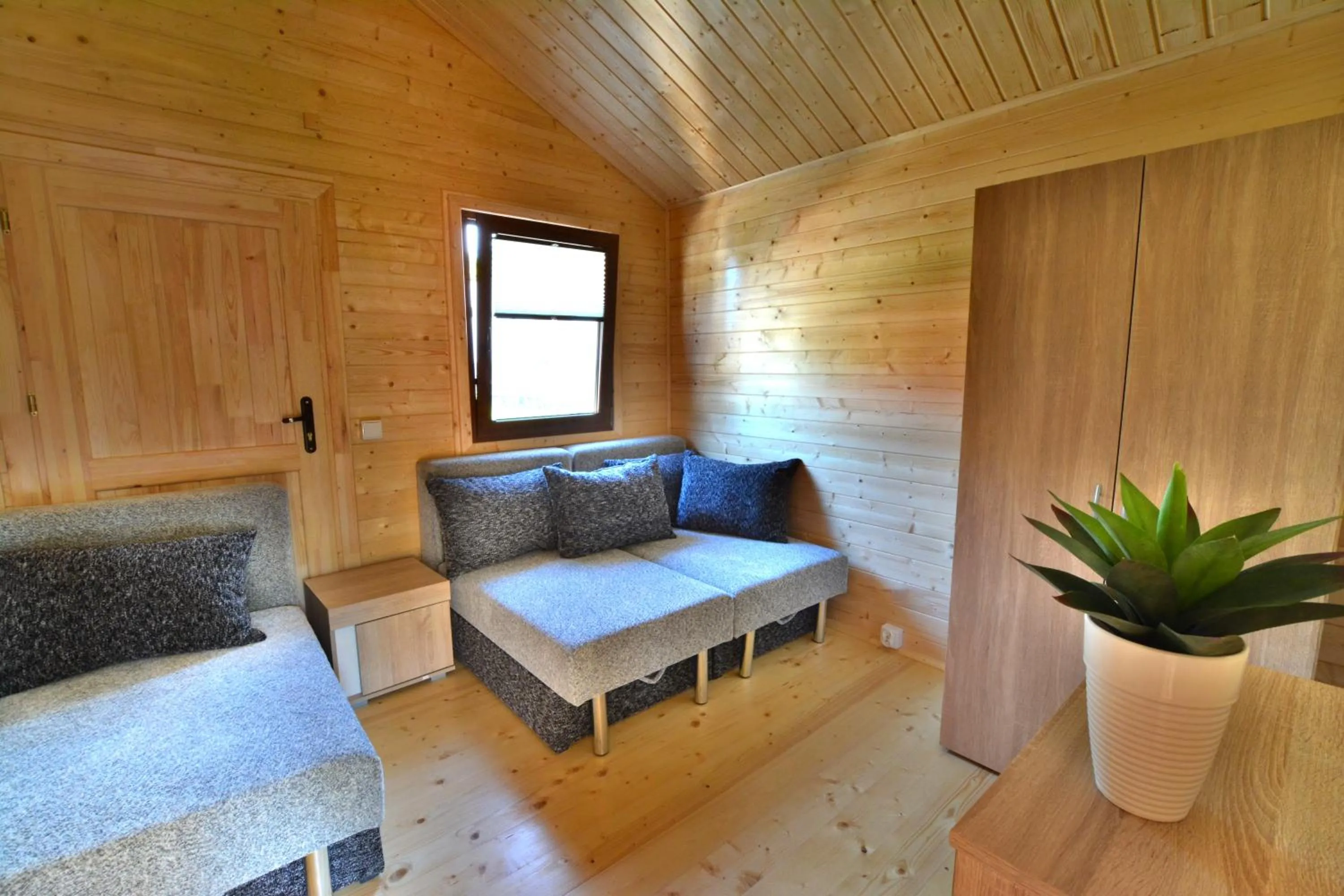 Bed in Tropikana Domki, Apartamenty