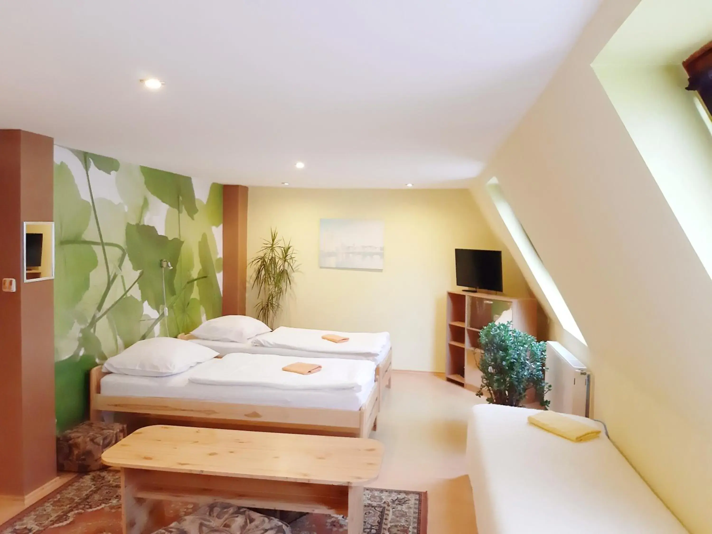 Quadruple Room with extra bed and Garden View in Penzion Havaj Quadruple Room with extra bed and Garden View in Penzion Havaj