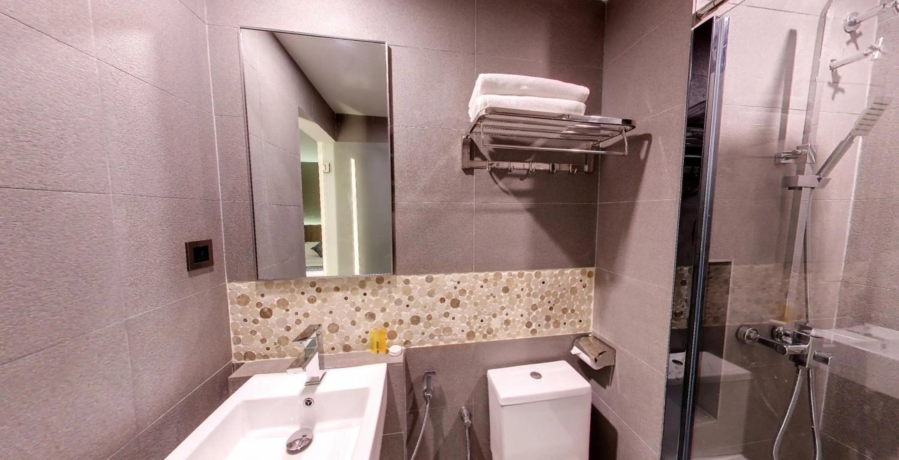 Toilet in Flora by Crossroads Hotel