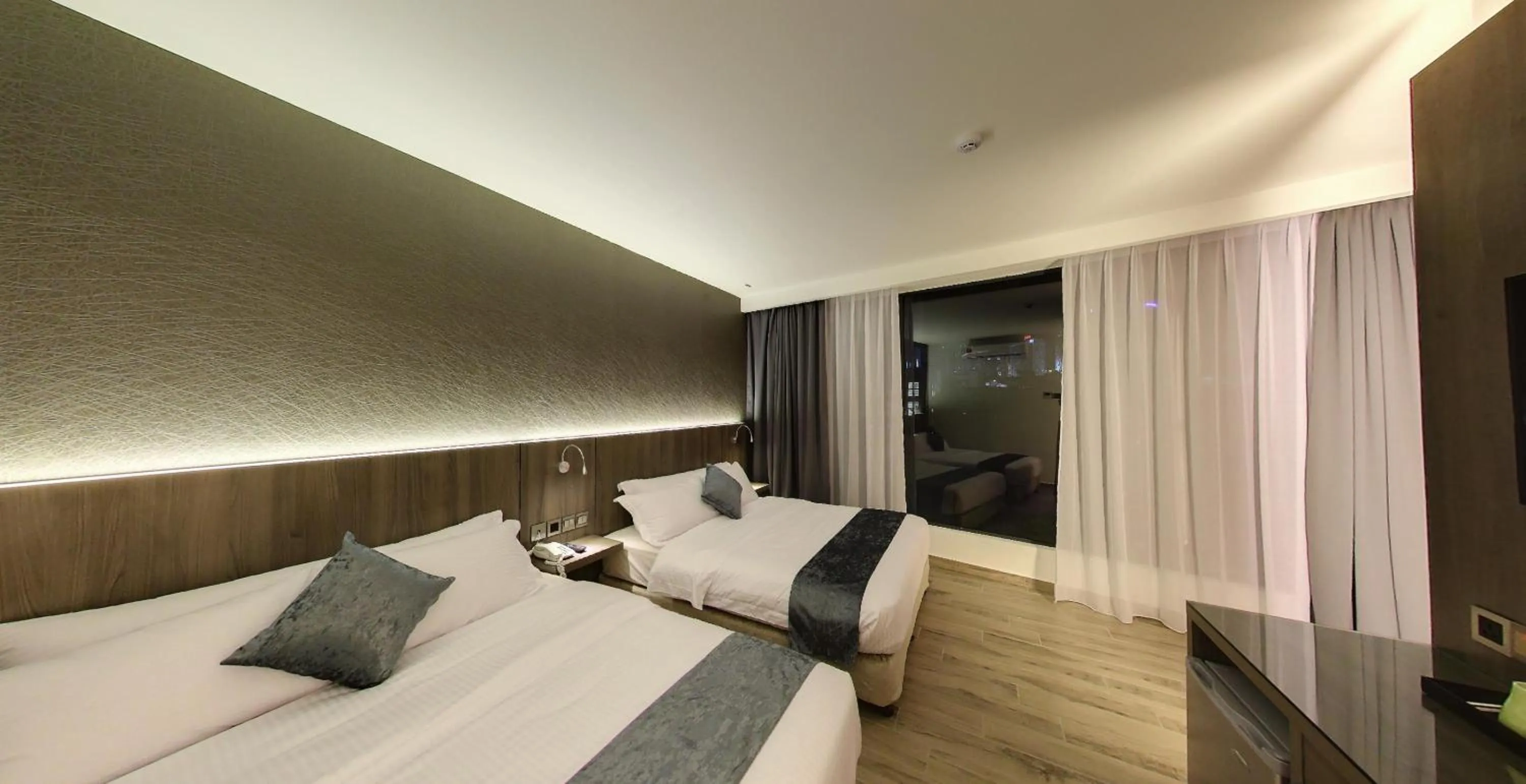 Bedroom in Flora by Crossroads Hotel