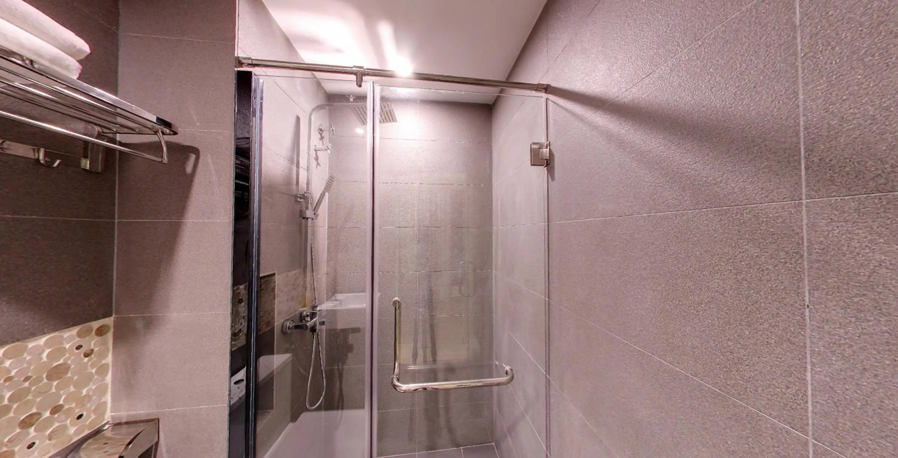 Shower in Flora by Crossroads Hotel