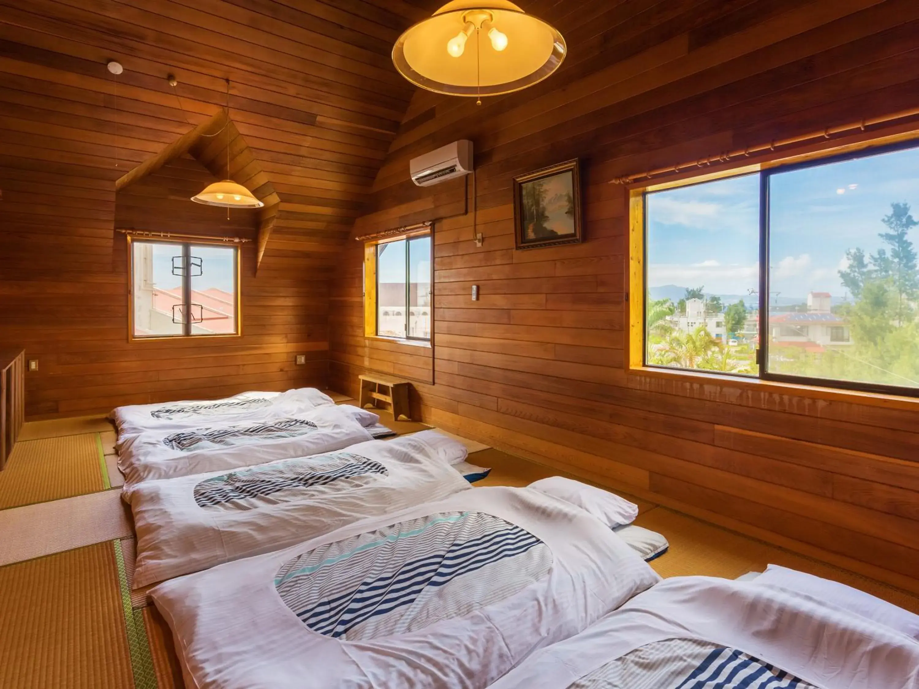 Living room, Bed in Kariyushi Condominium Resort Yuudekiya Living room, Bed in Kariyushi Condominium Resort Yuudekiya