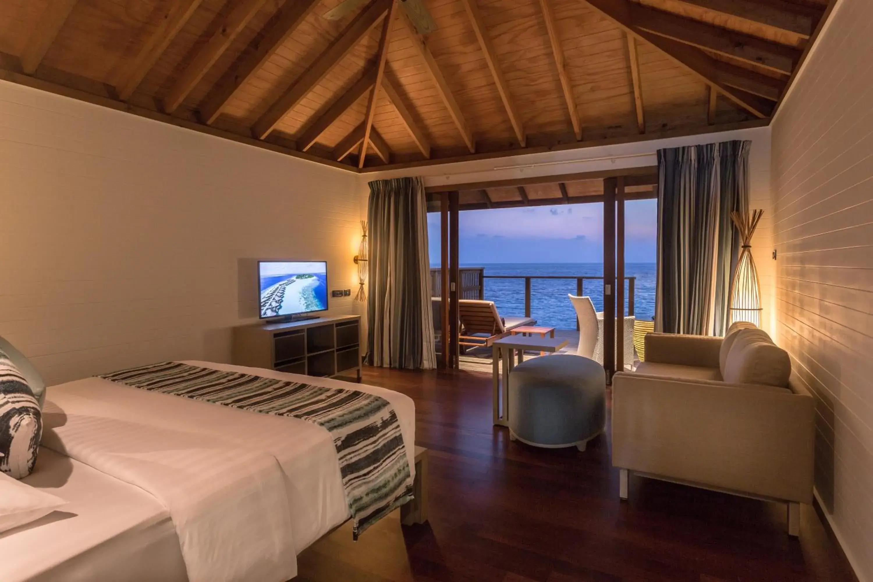 Photo of the whole room, Bed in Vilamendhoo Island Resort & Spa Photo of the whole room, Bed in Vilamendhoo Island Resort & Spa