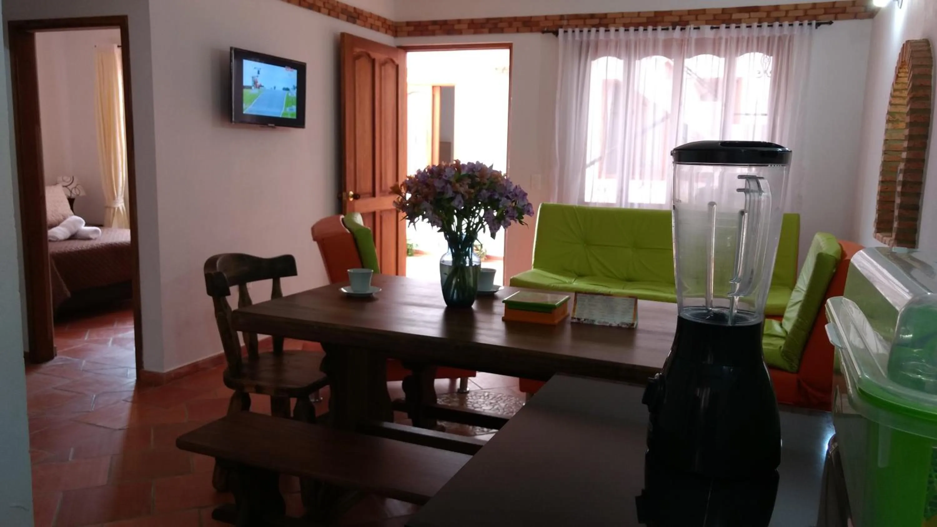 Kitchen or kitchenette, Bed in Apartahotel La Gran Familia