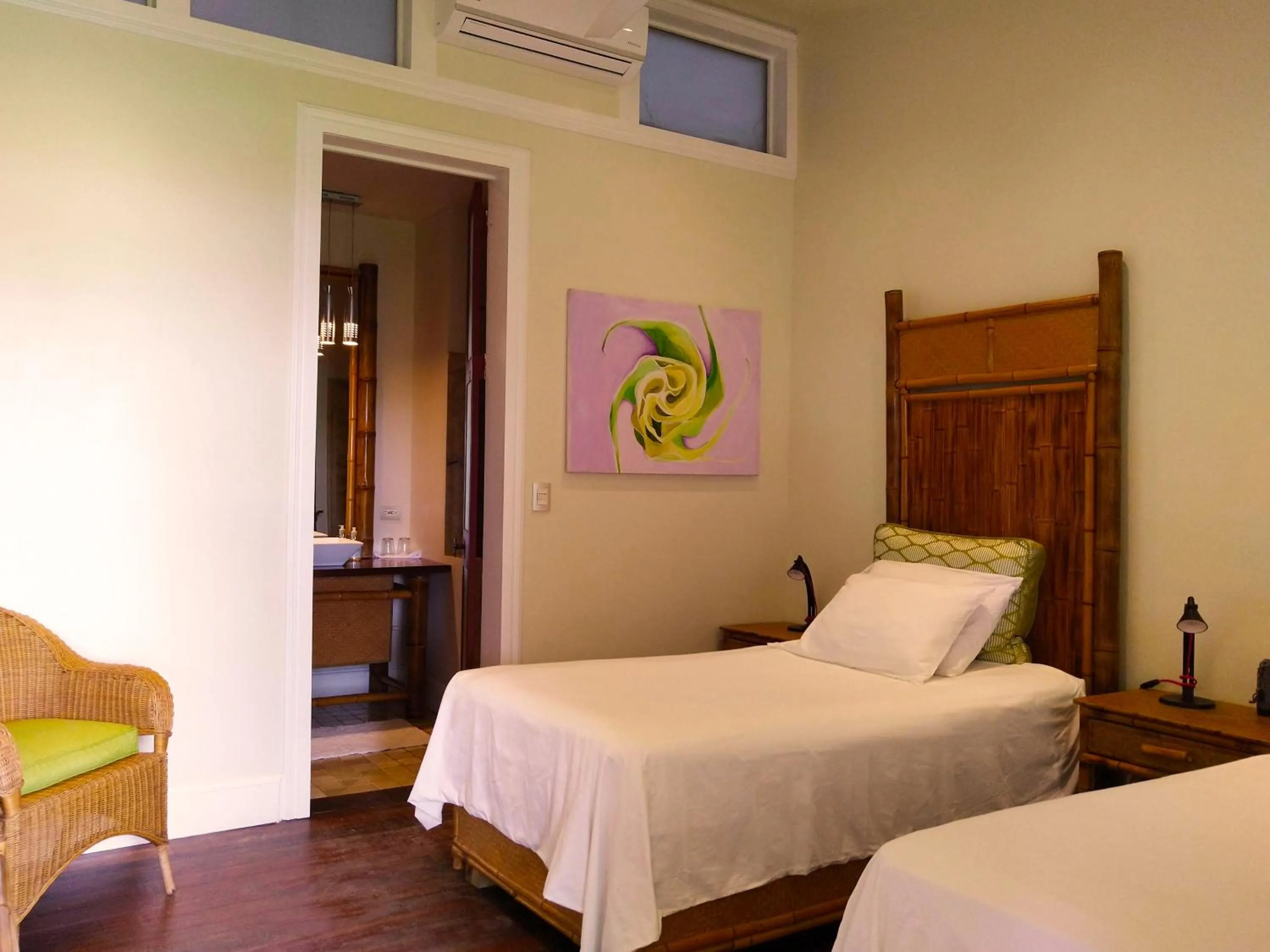 Bed in Iguana Lodge Beach Resort