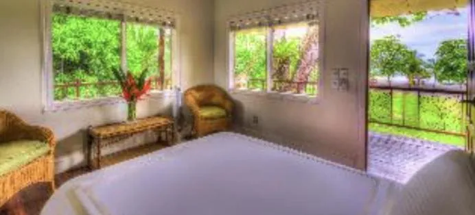 Bed in Iguana Lodge Beach Resort