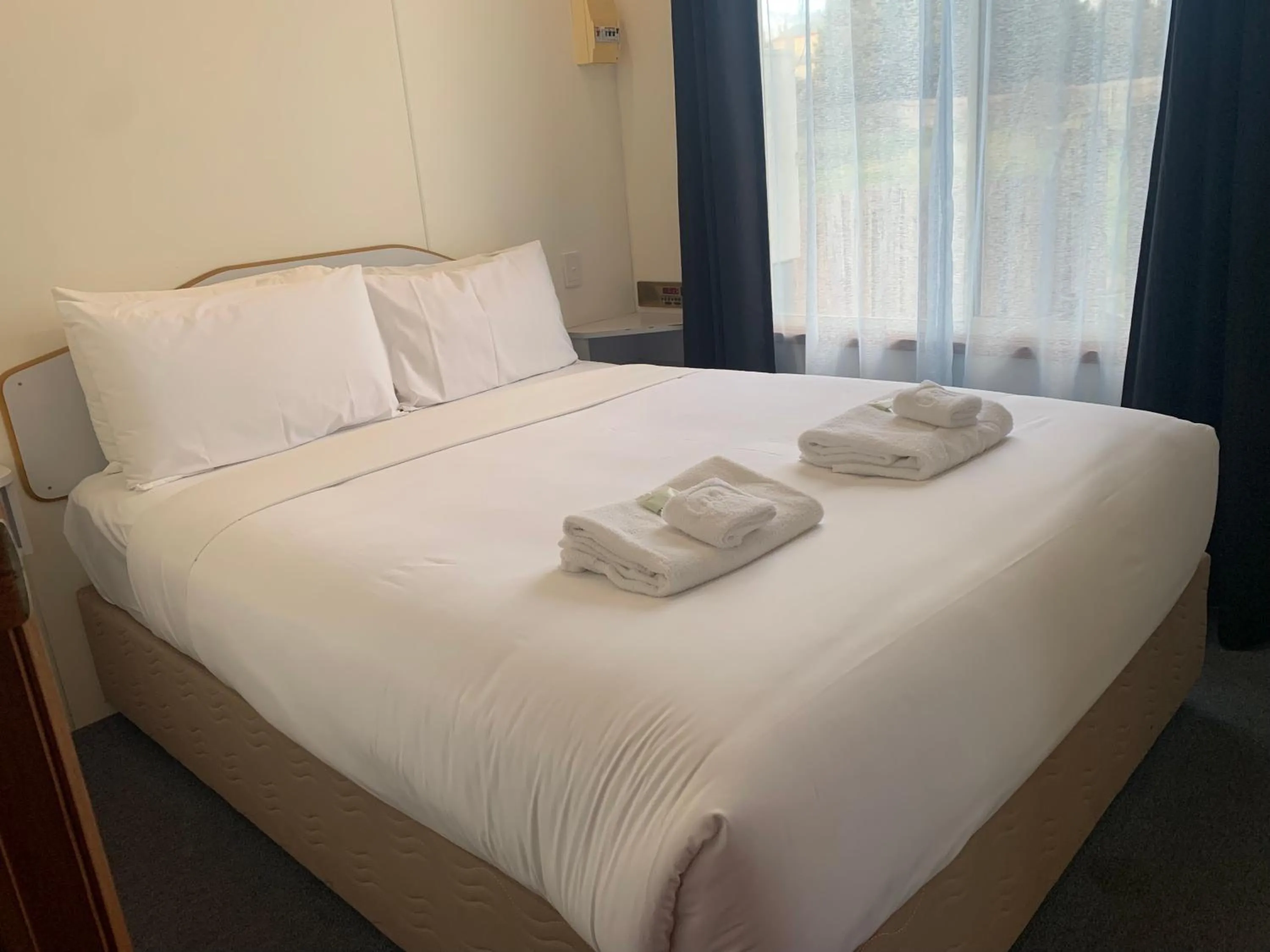 Bed in Miner's Retreat Motel