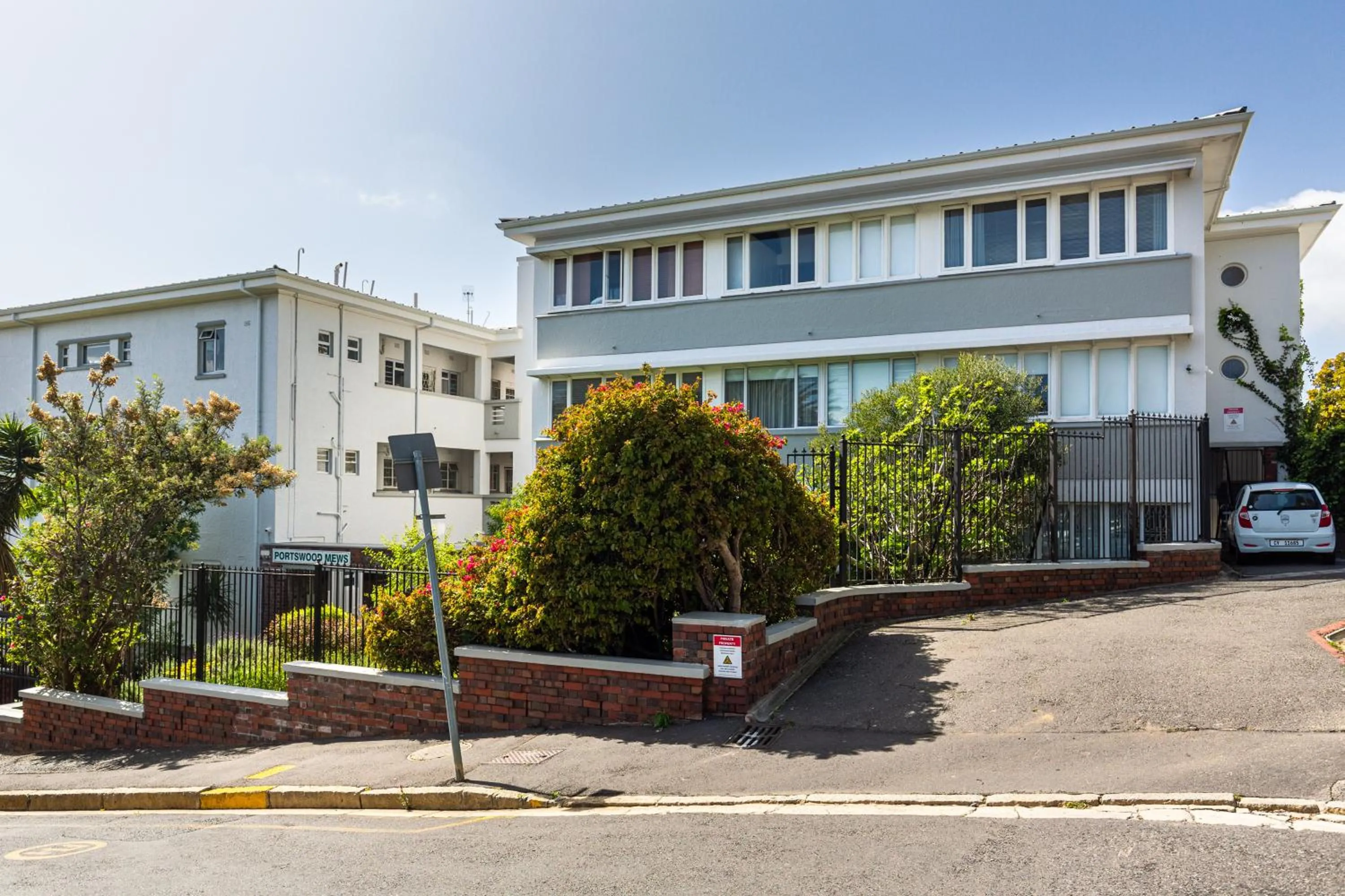 Property building in Portswood Mews - Chic White Studio Apartment Green Point