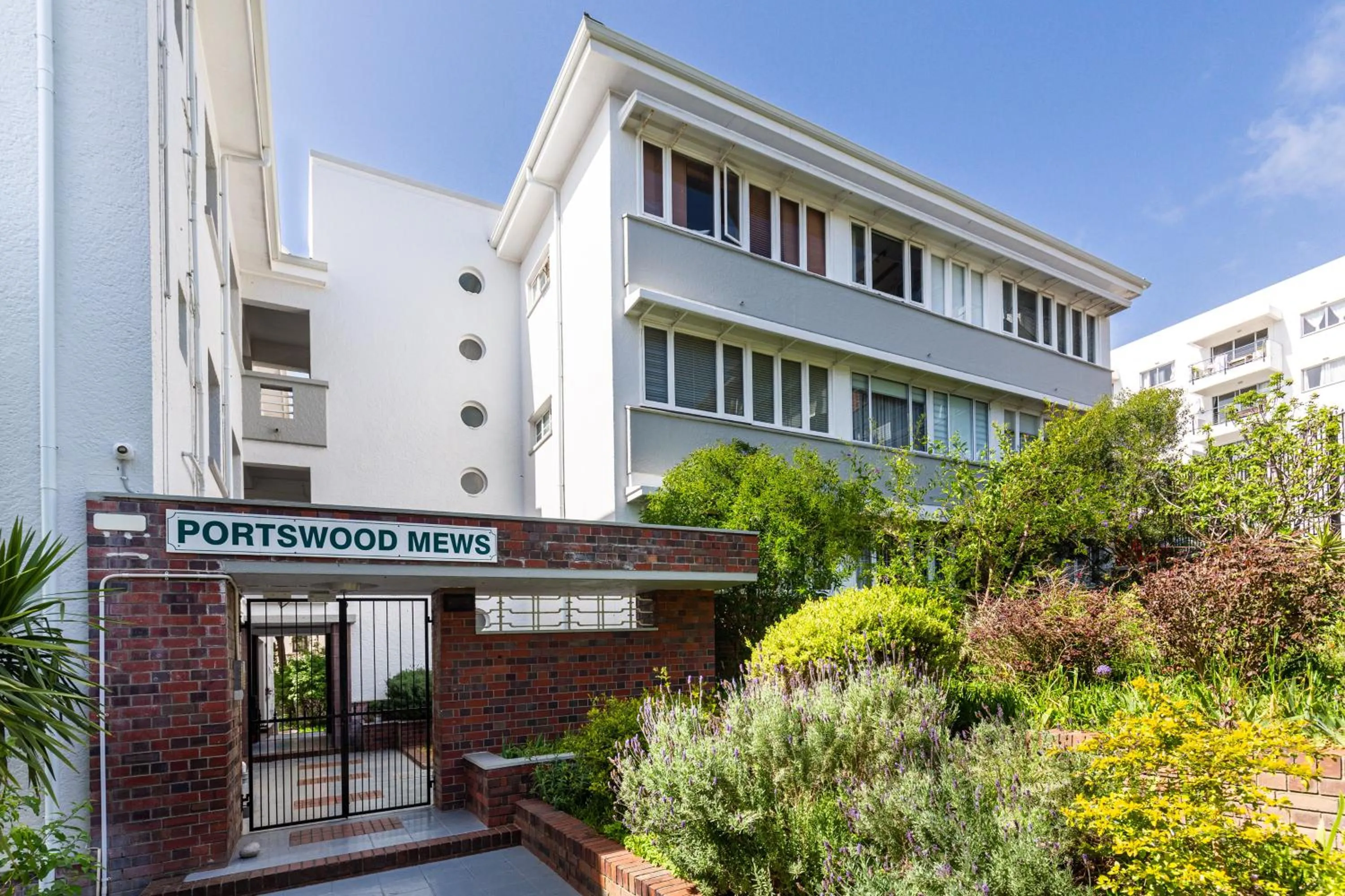 Property building in Portswood Mews - Chic White Studio Apartment Green Point