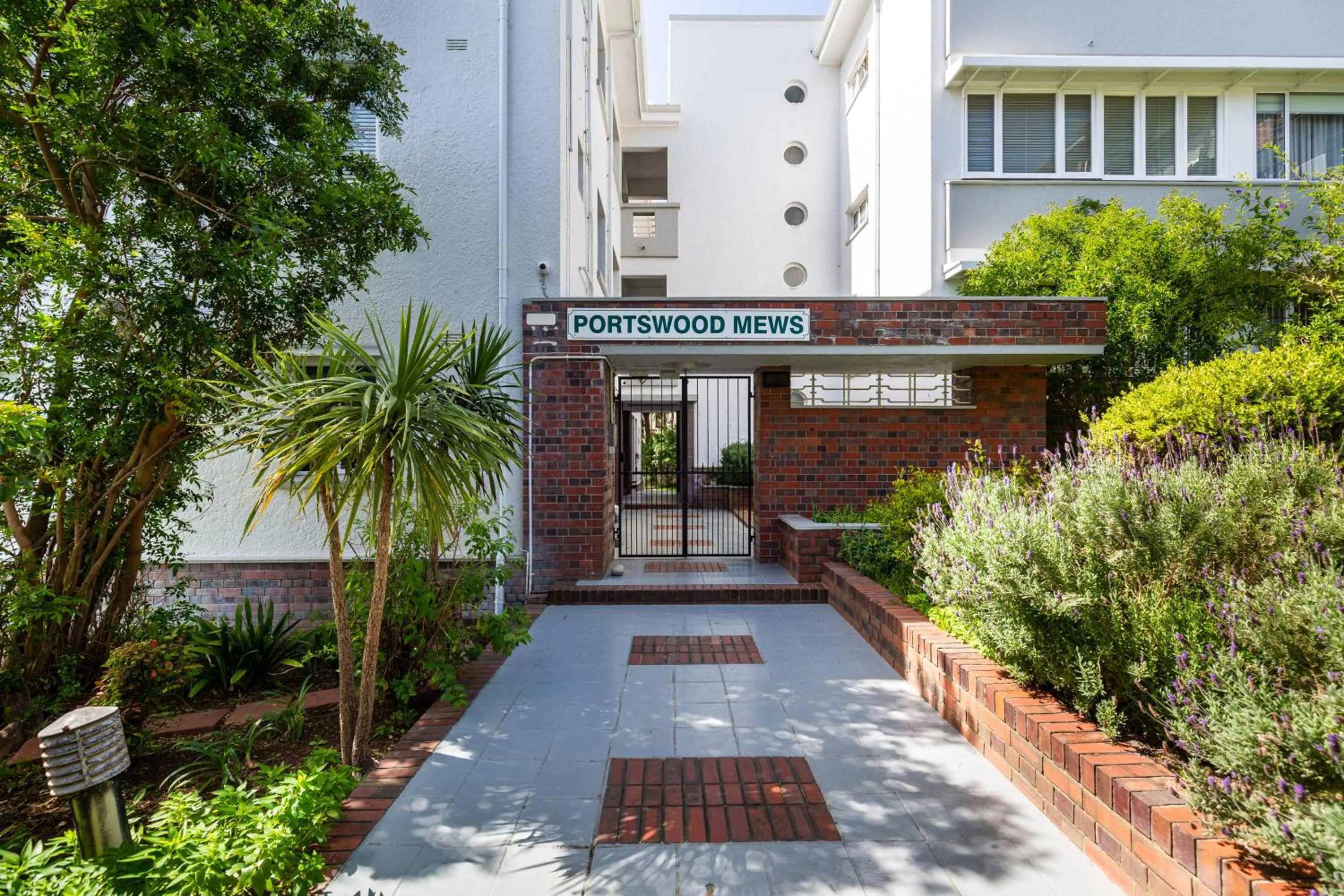 Property building in Portswood Mews - Chic White Studio Apartment Green Point