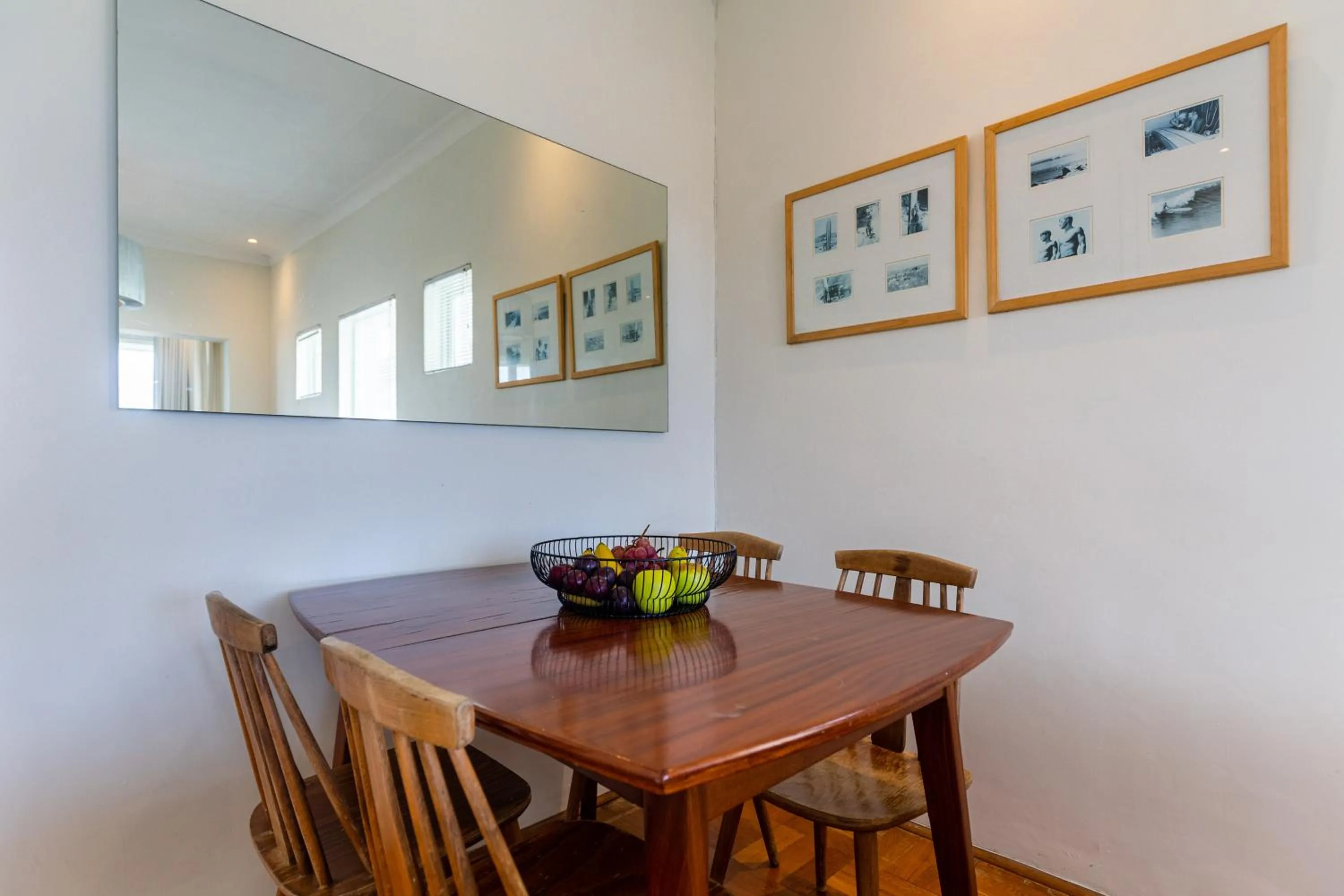 Dining area in Portswood Mews - Chic White Studio Apartment Green Point