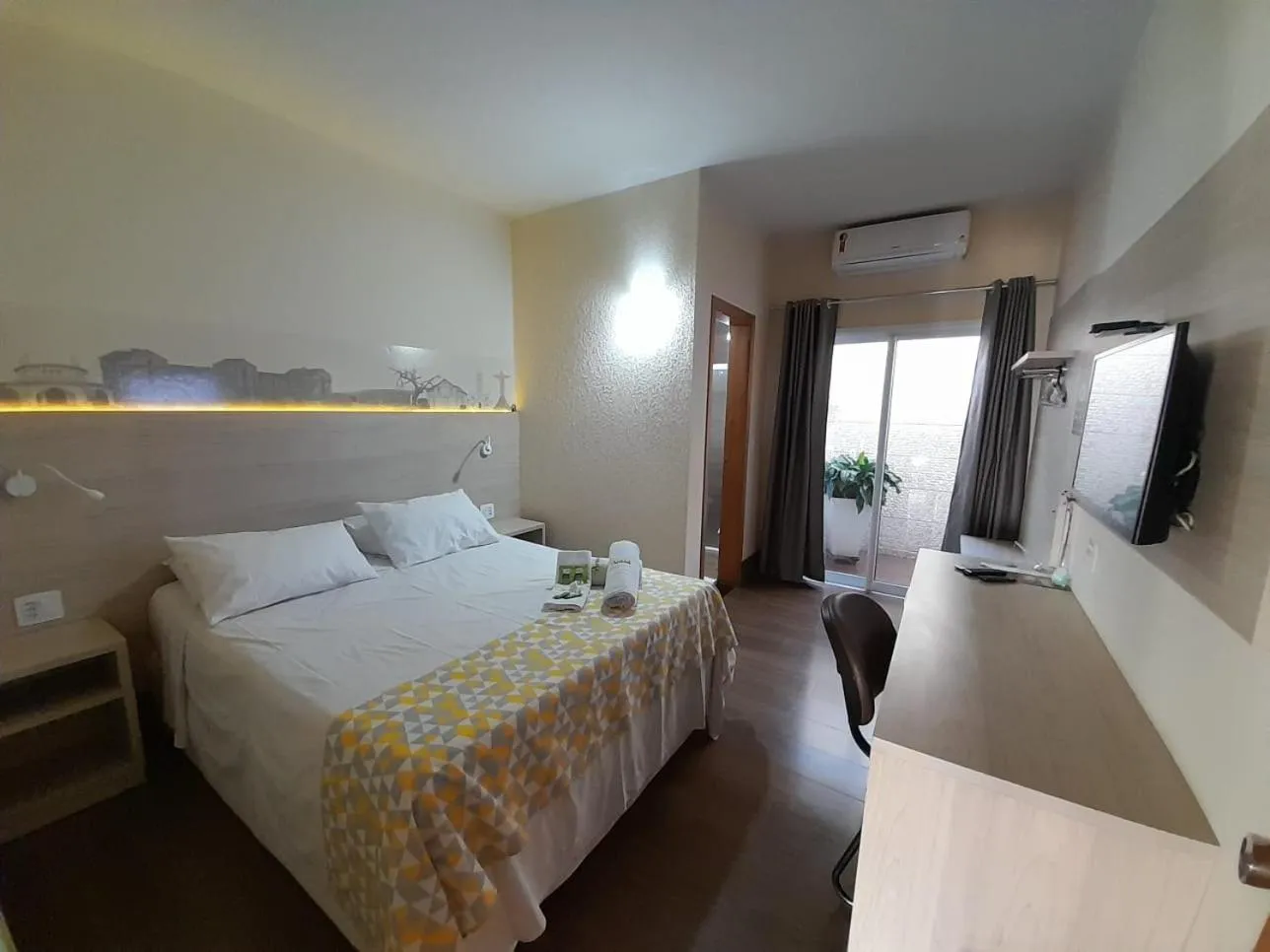 Bed in Pousada Araxá