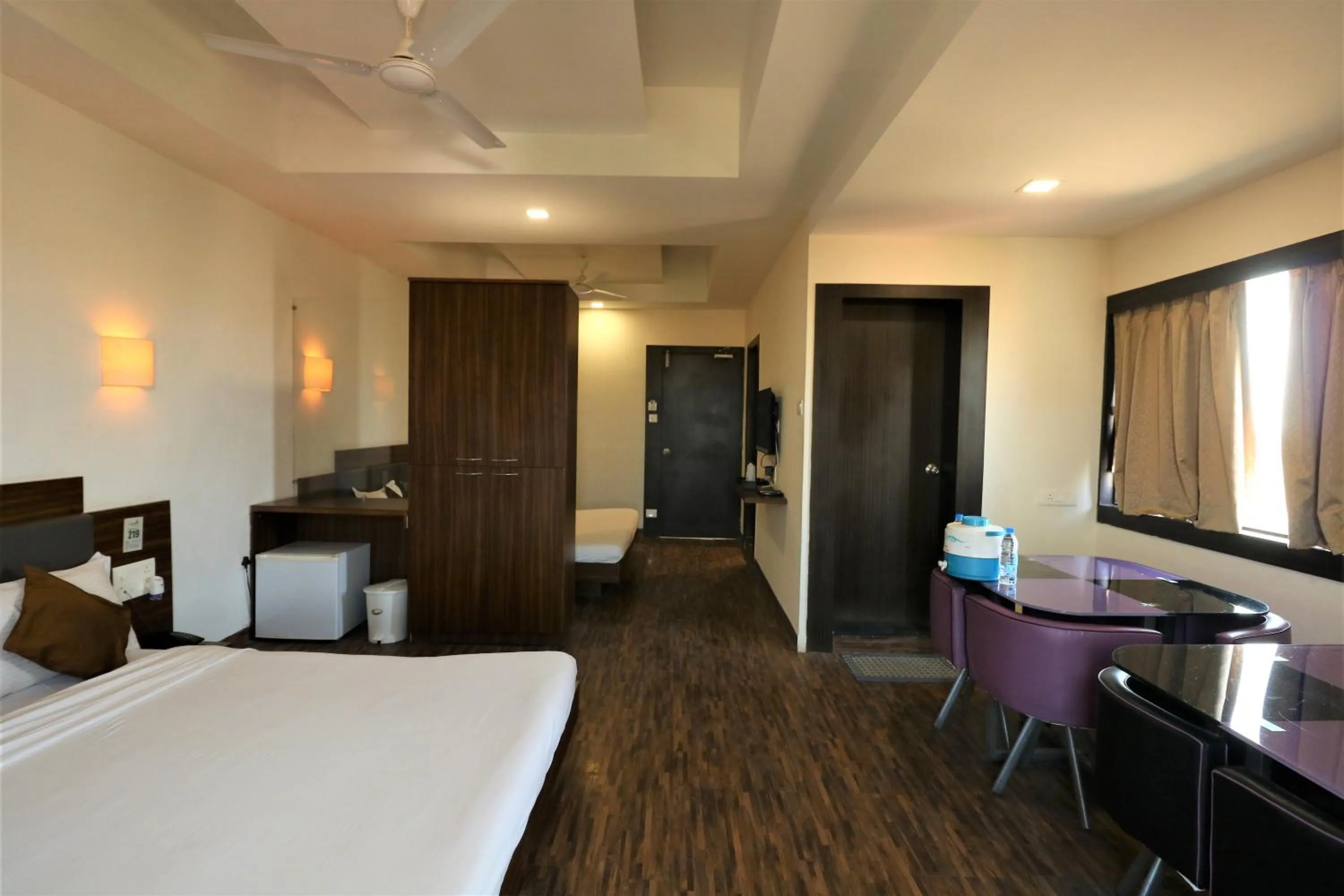 Photo of the whole room, Bed in Goverdhan Greens Resort Dwarka l Hotels In Dwarka