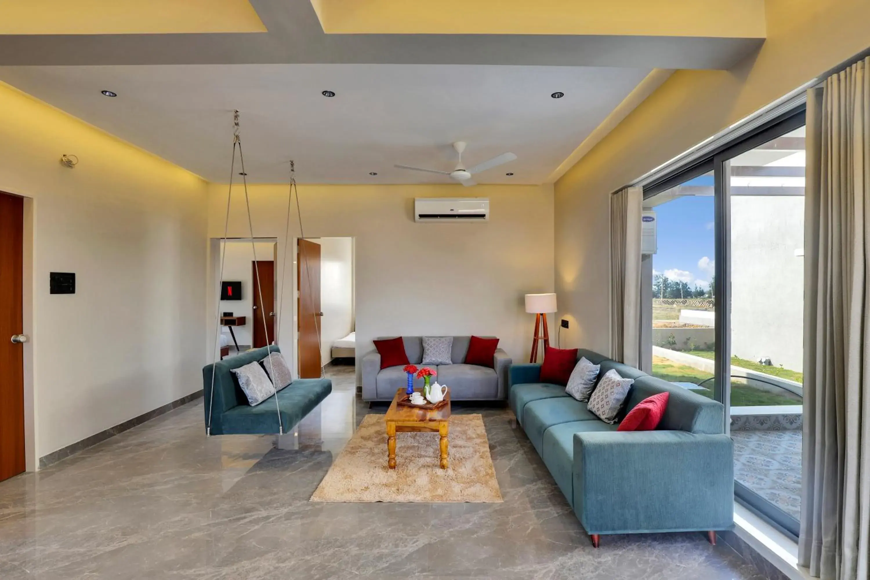 Living room in Goverdhan Greens Resort Dwarka l Hotels In Dwarka Living room in Goverdhan Greens Resort Dwarka l Hotels In Dwarka