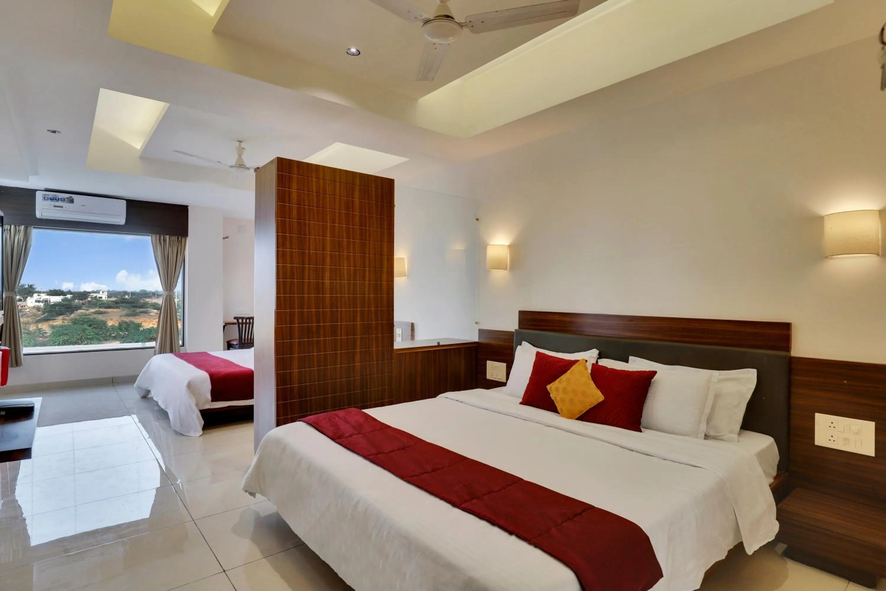 Photo of the whole room, Bed in Goverdhan Greens Resort Dwarka l Hotels In Dwarka