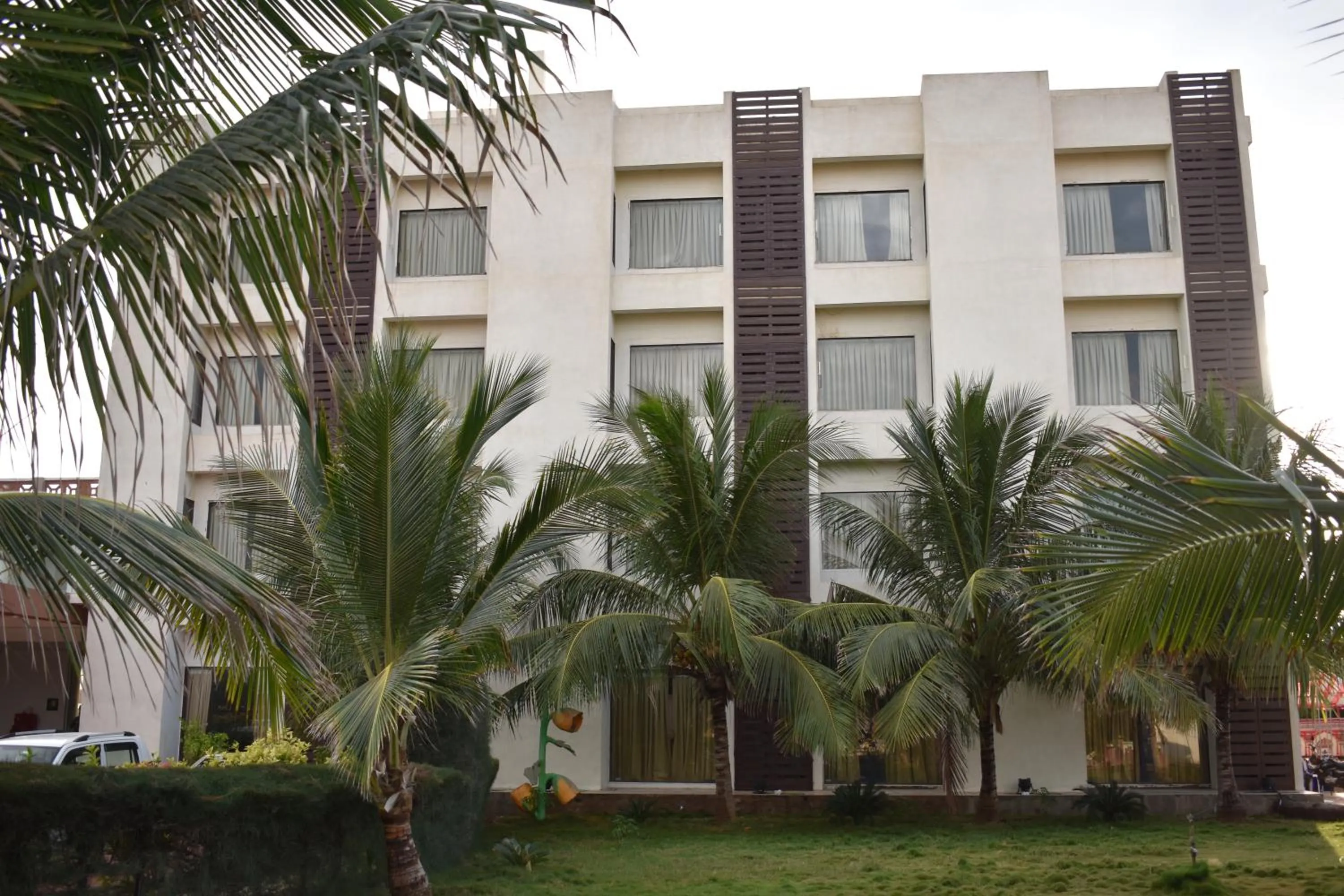 Property building in Goverdhan Greens Resort Dwarka l Hotels In Dwarka