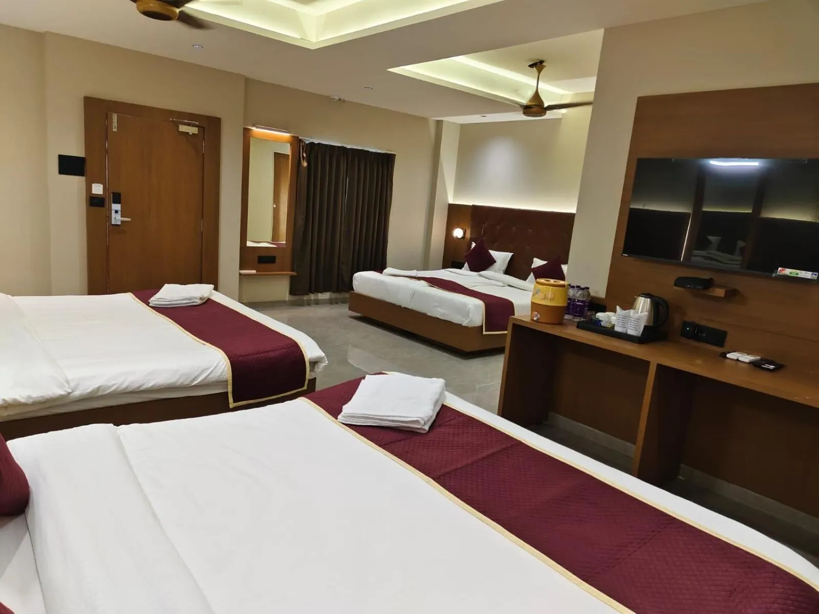 TV and multimedia, Bed in Goverdhan Greens Resort Dwarka l Hotels In Dwarka