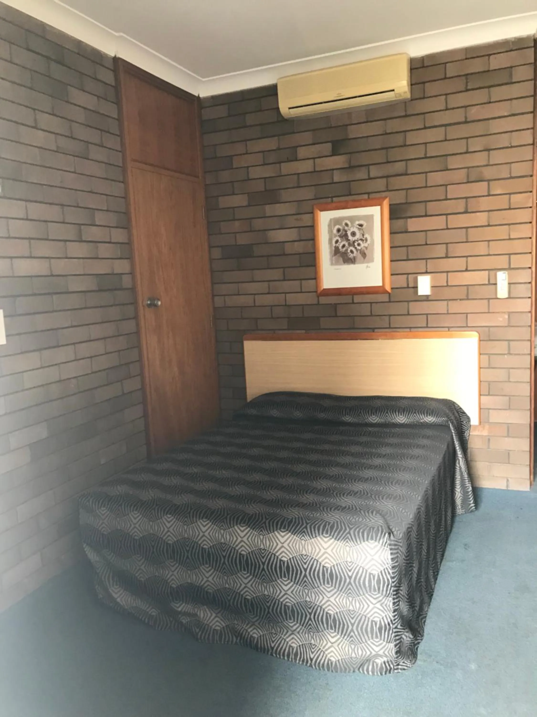 Bed in Downtown Motel