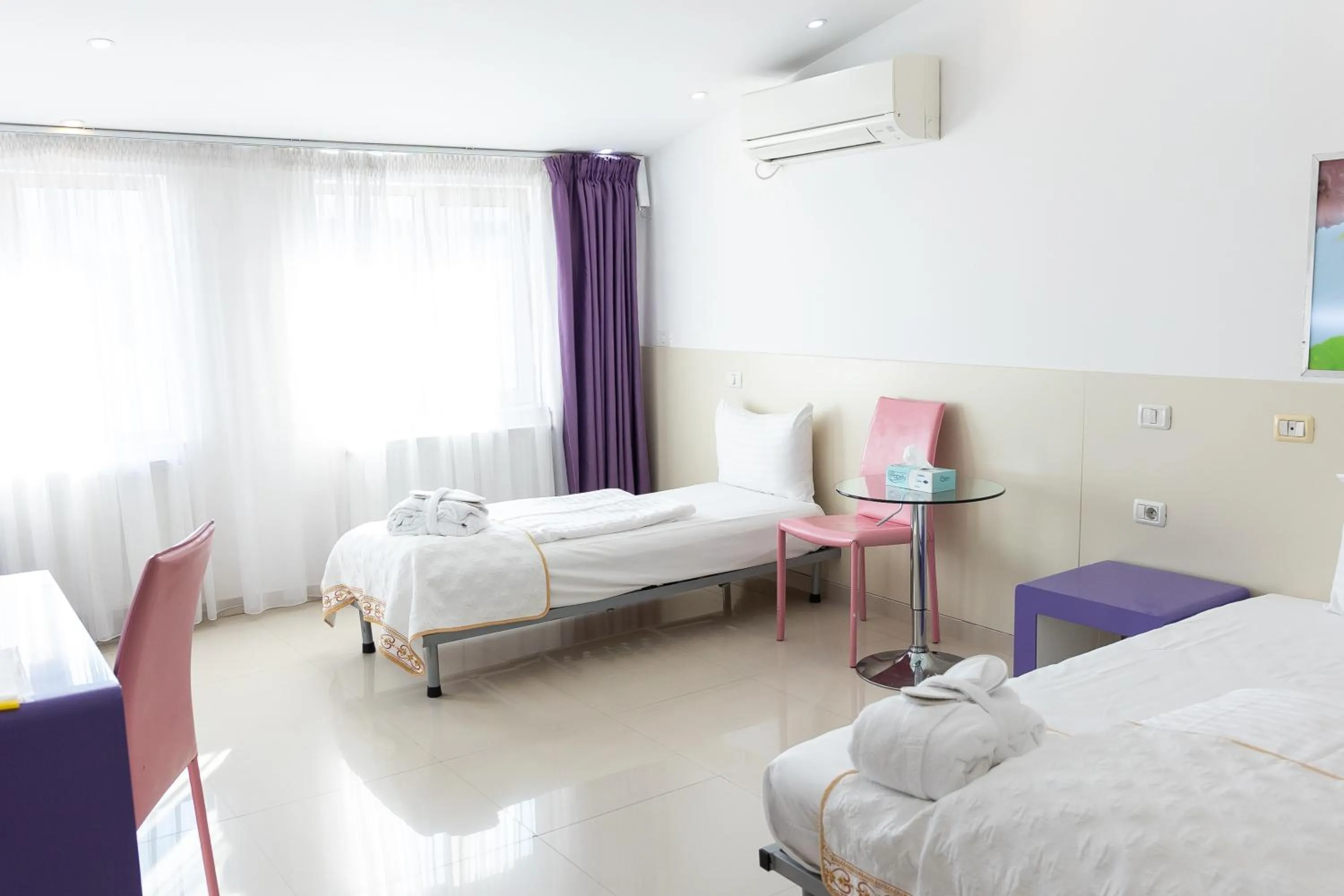 Bed in Hotel Christina Plus