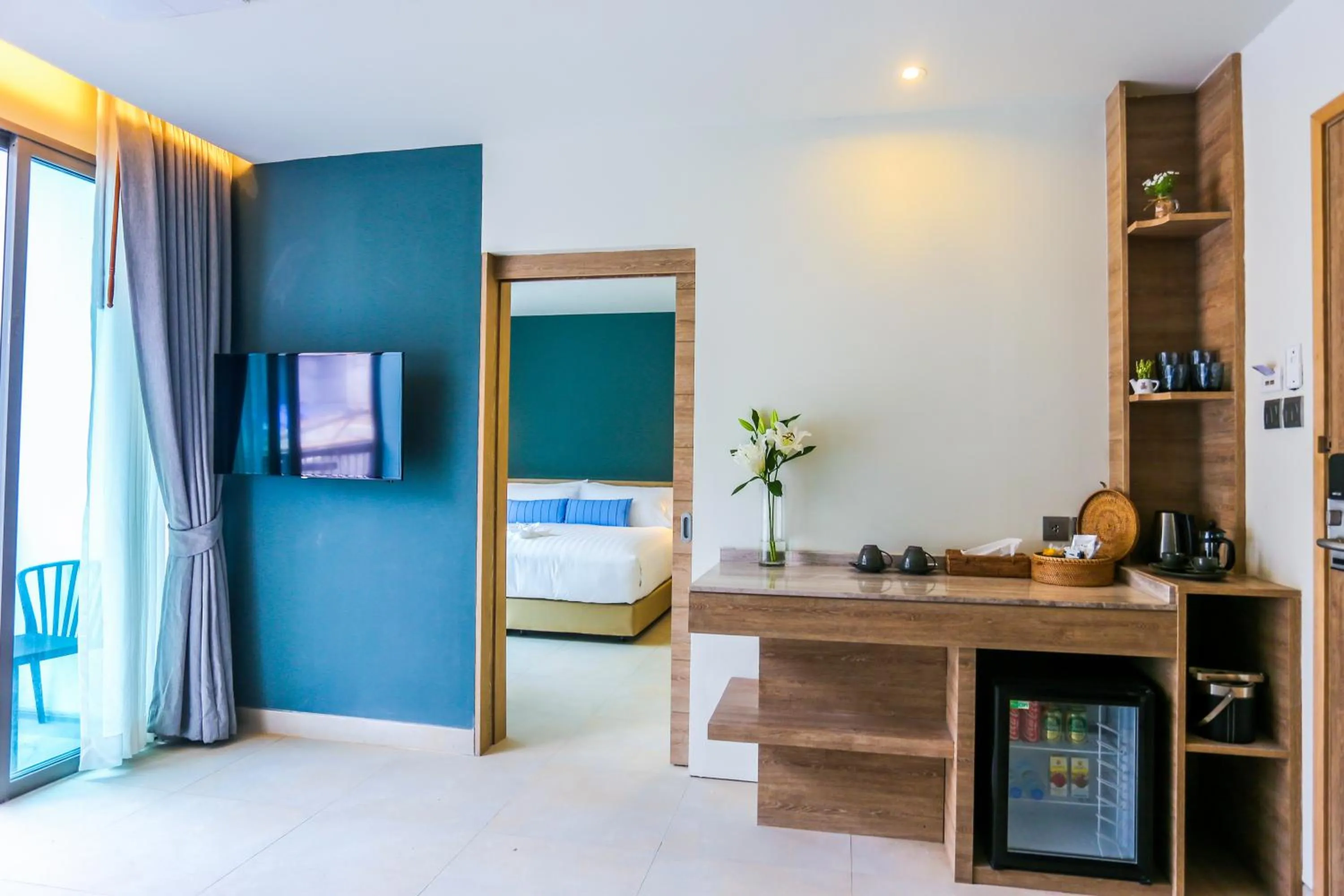 Living room, Bed in Fusion Suites Phuket Patong