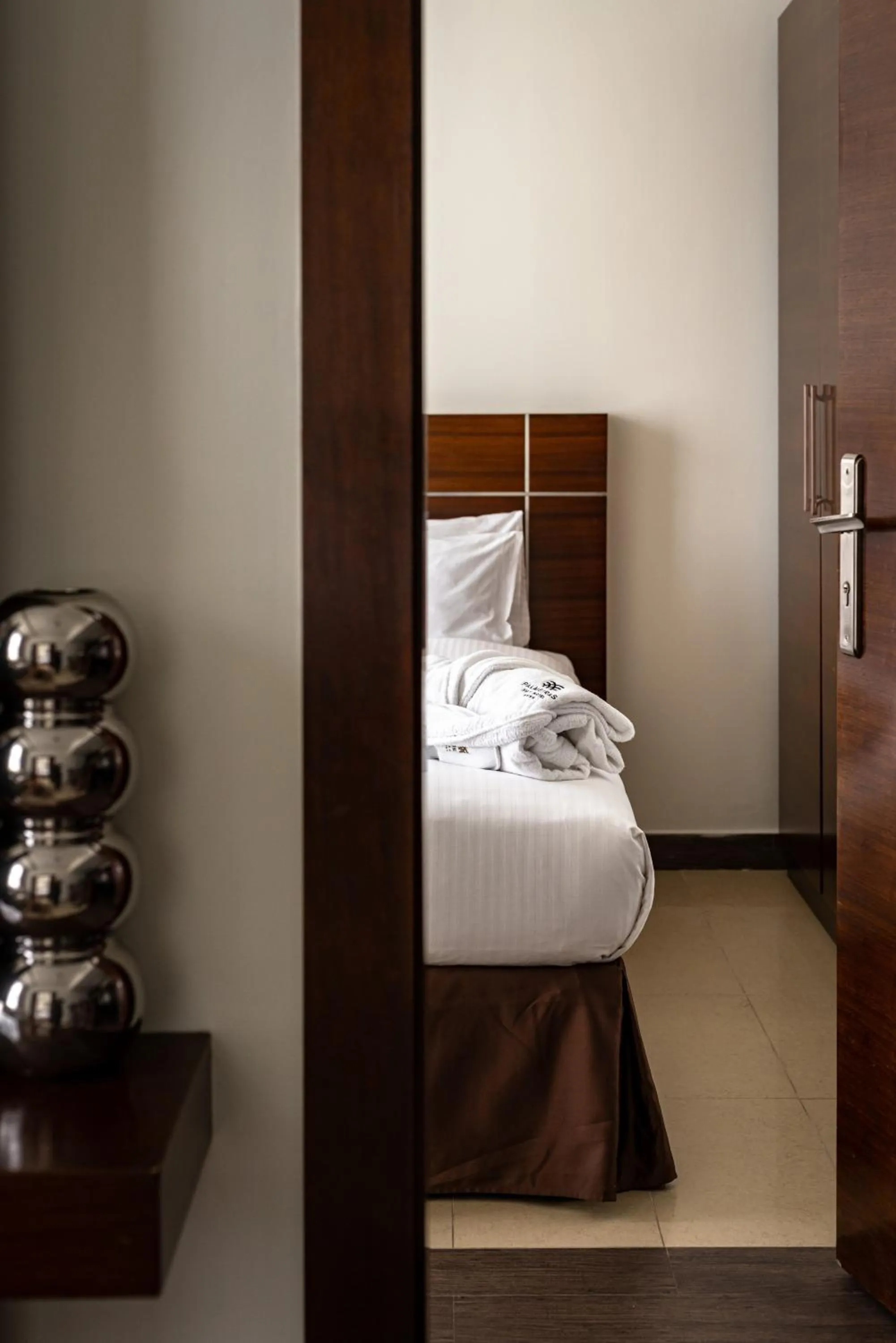 Bed in Palmeiras Suite Hotel