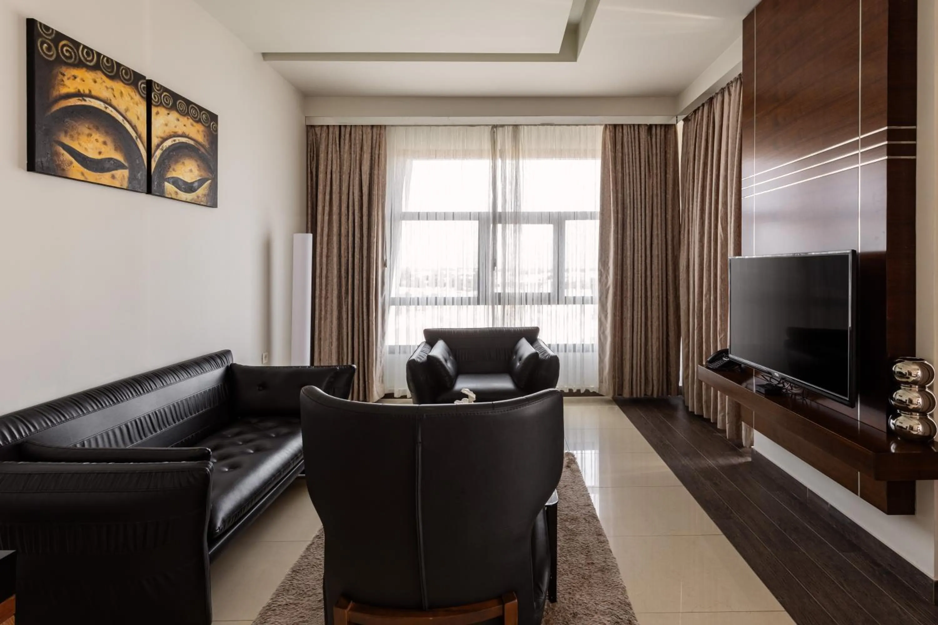 Living room in Palmeiras Suite Hotel