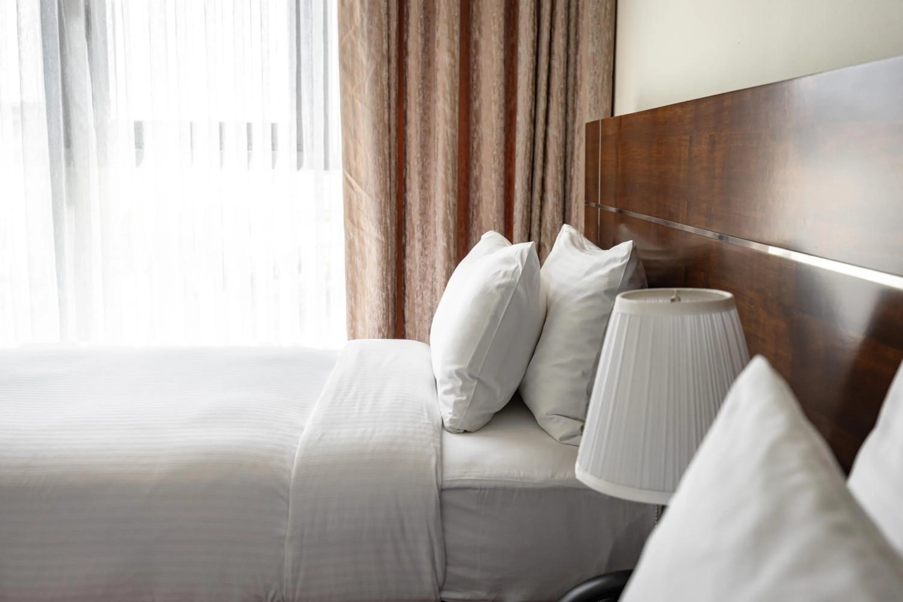 Bed in Palmeiras Suite Hotel