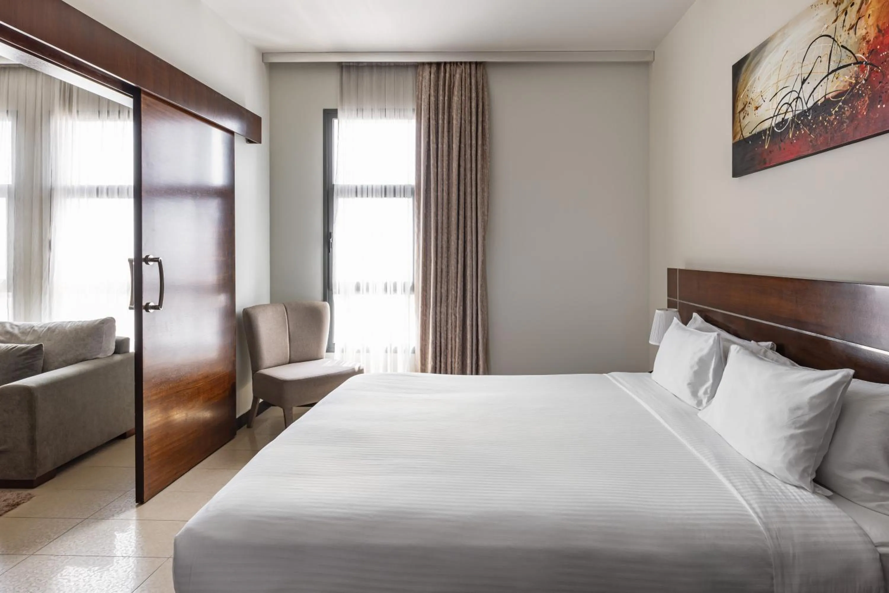 Bed in Palmeiras Suite Hotel