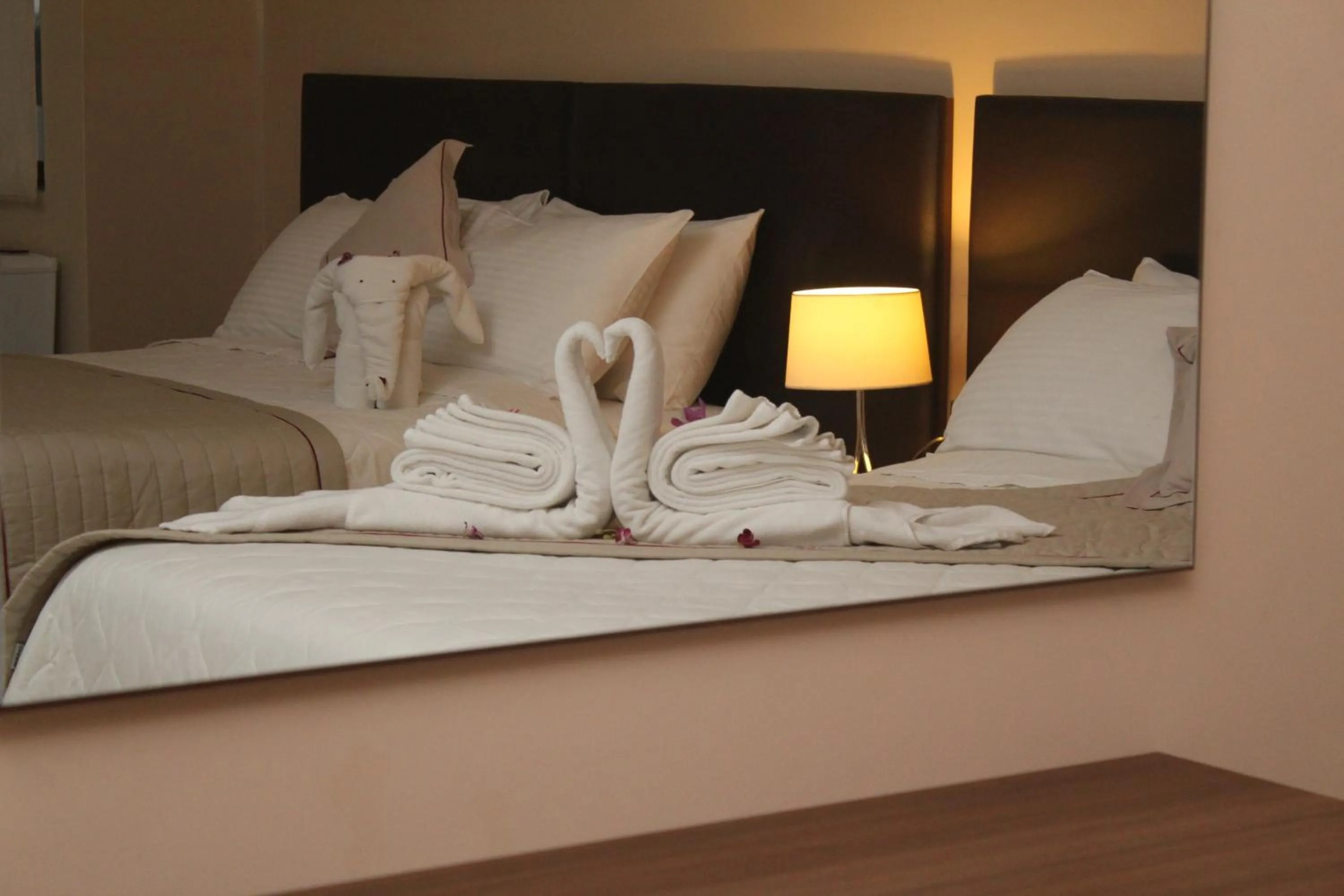 Bed in Murex Plaza Hotel & Suites
