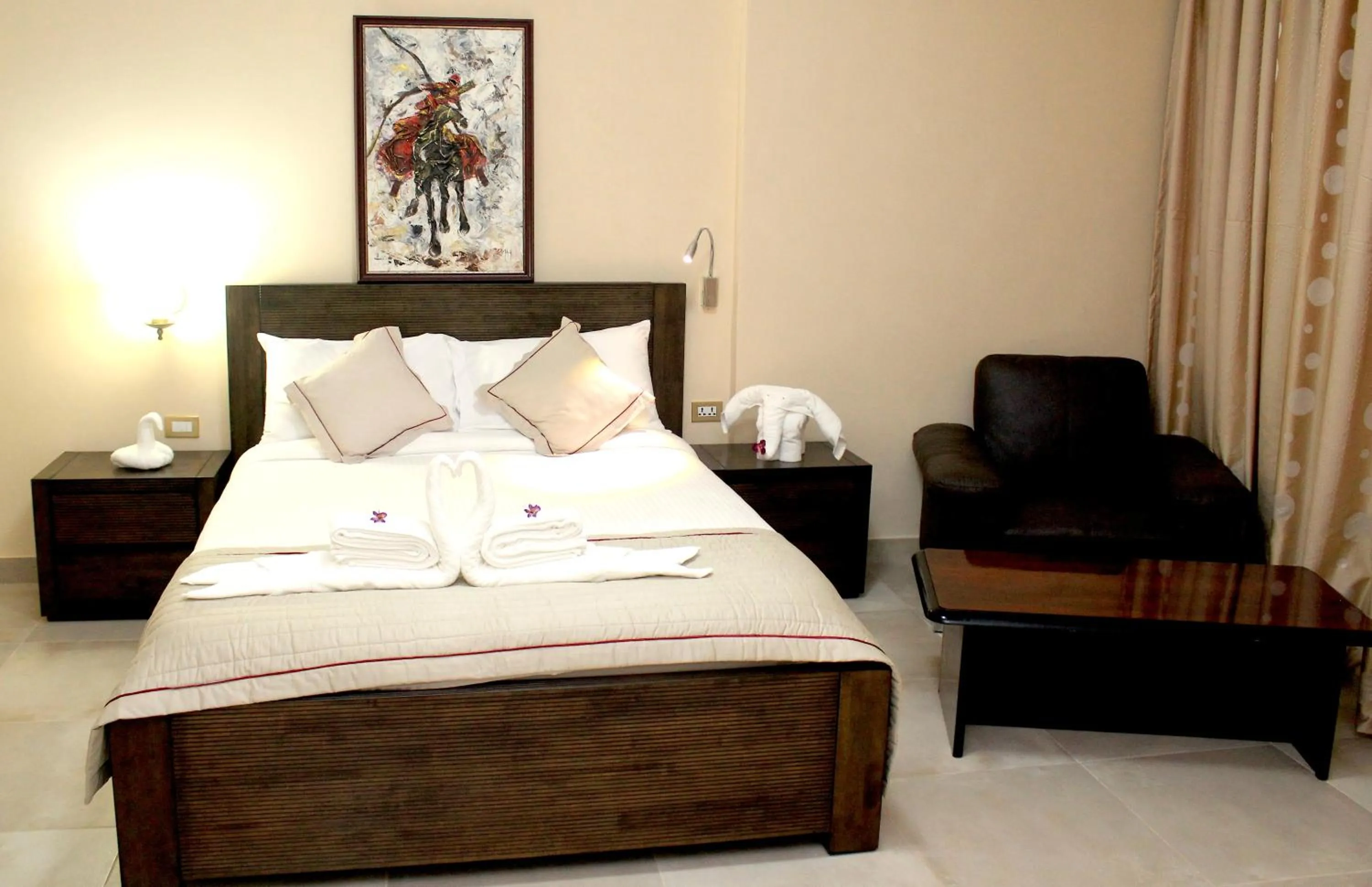 Bed in Murex Plaza Hotel & Suites